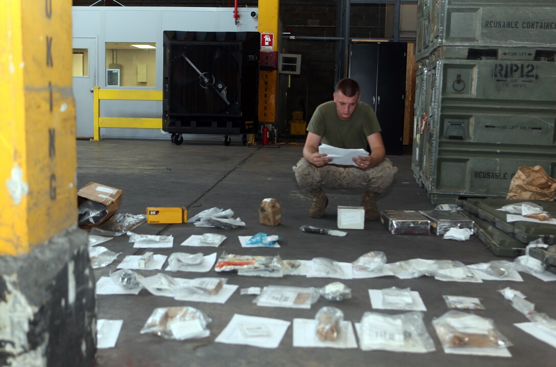 Cpl. Jonathon C. Head, a supply clerk with Combat Logistics Battalion 22, 2nd Marine Logistics Group, checks over a gear list in the CLB-22 supply warehouse on Camp Lejeune, N.C., Aug. 9, 2012.  Head is currently inventorying more than 20,000 items, and so far has corrected more than $200,000 worth of deficiencies. (U.S. Marine Corps photo by Sgt. Rachael K. A. Moore)