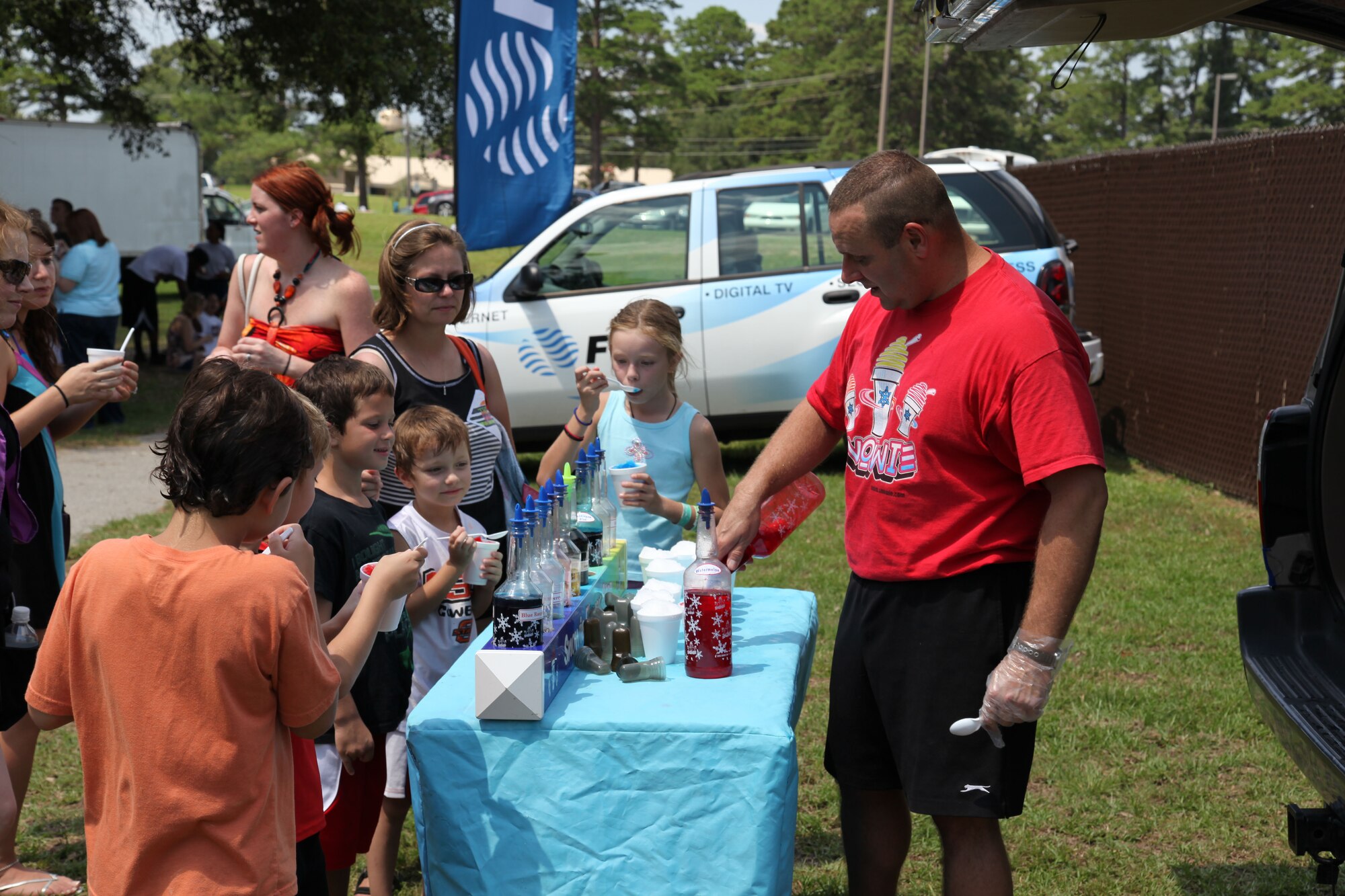 SHAW AIR FORCE BASE, S.C. – Jessie Voisin of "Snowie of Sumter" makes snow cones during the Summer Splash event at Woodland Pool on Shaw Air Force Base, S.C., Aug. 13, 2012. More than 1,200 members of Team Shaw participated in the event that was sponsored by the city of Sumter, S.C., Farmer's Telephone Cooperative, Progress Energy and 20th Fighter Wing members.  Attendees were treated to free food, face painting, water games, music and snow cones. (U.S.  Air Force photo by Master Sgt. Cohen A. Young/Released)