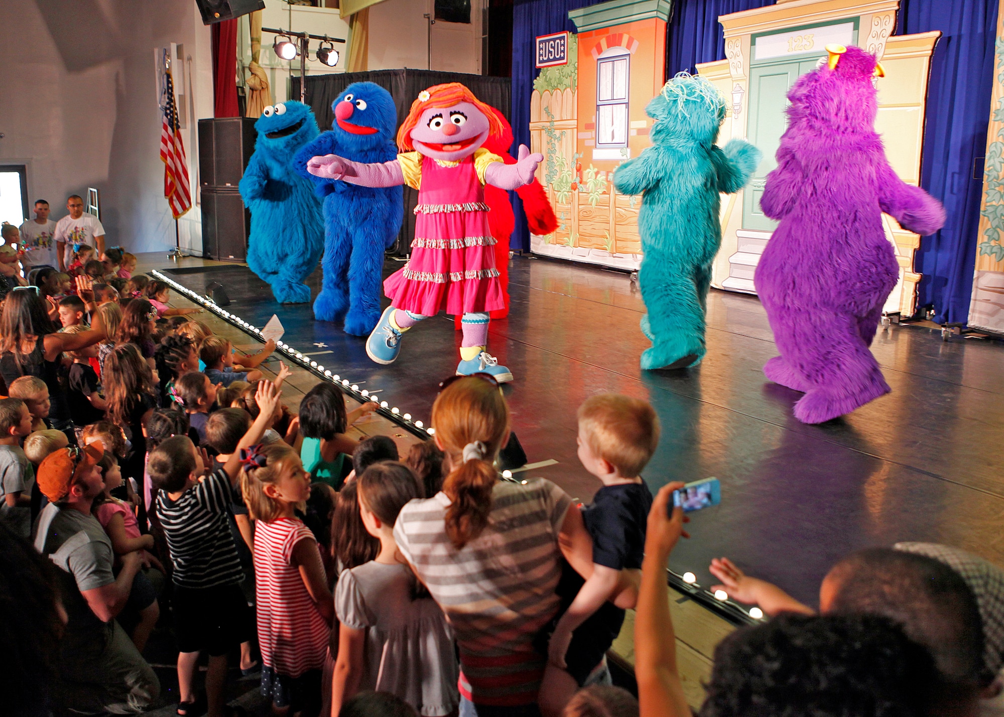 Military ID card holders and their guests were invited to attend the "Sesame Street USO Experience for Military Families" Aug. 10. Two shows were held in the Oasis Community Center's Stripes Lounge. (U.S. Air Force photo by Jet Fabara)