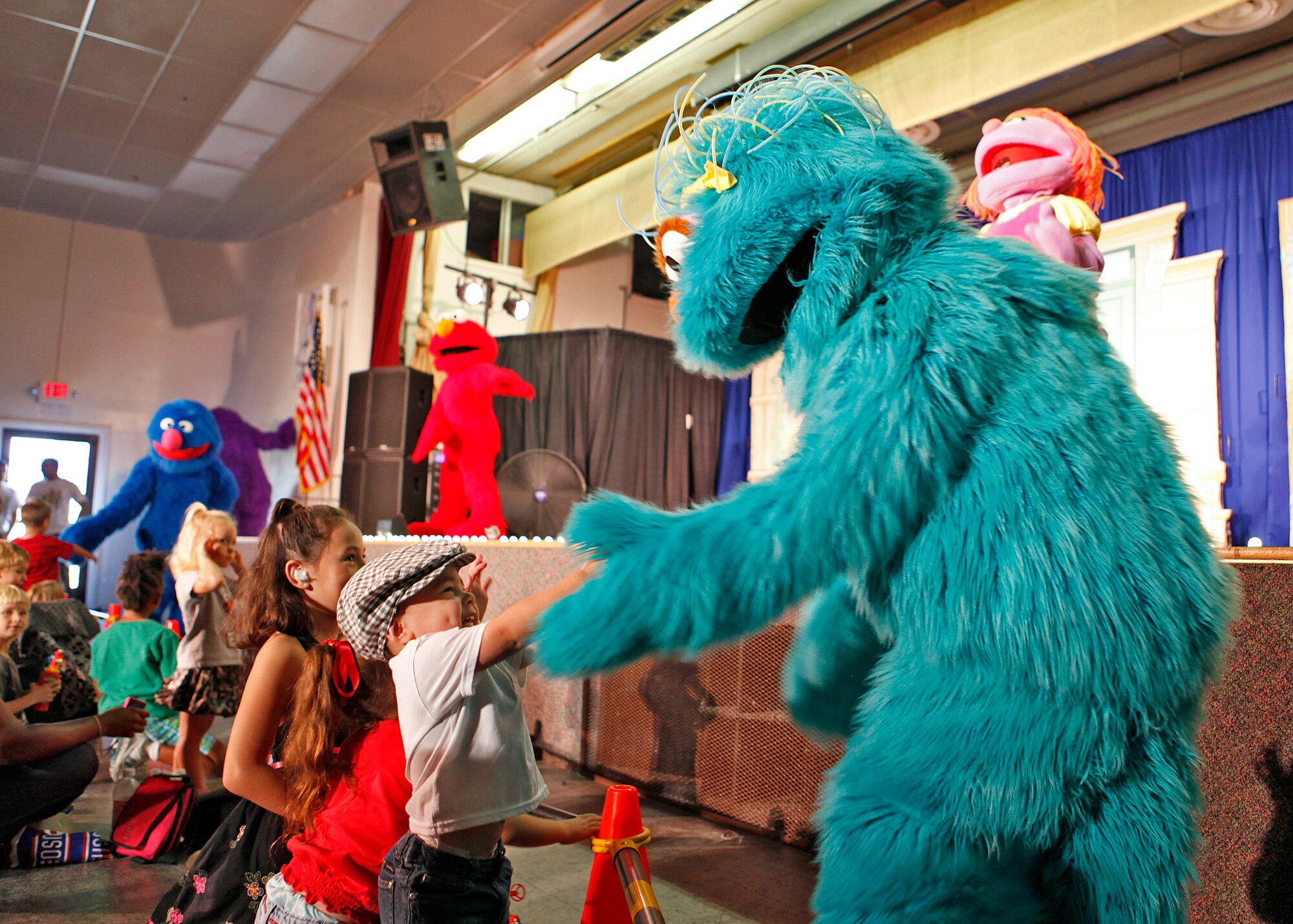 Francis Rivera was just one of the many children at Edwards who was able to meet one of the Sesame Street characters touring on the USO tour. (U.S. Air Force photo by Jet Fabara)