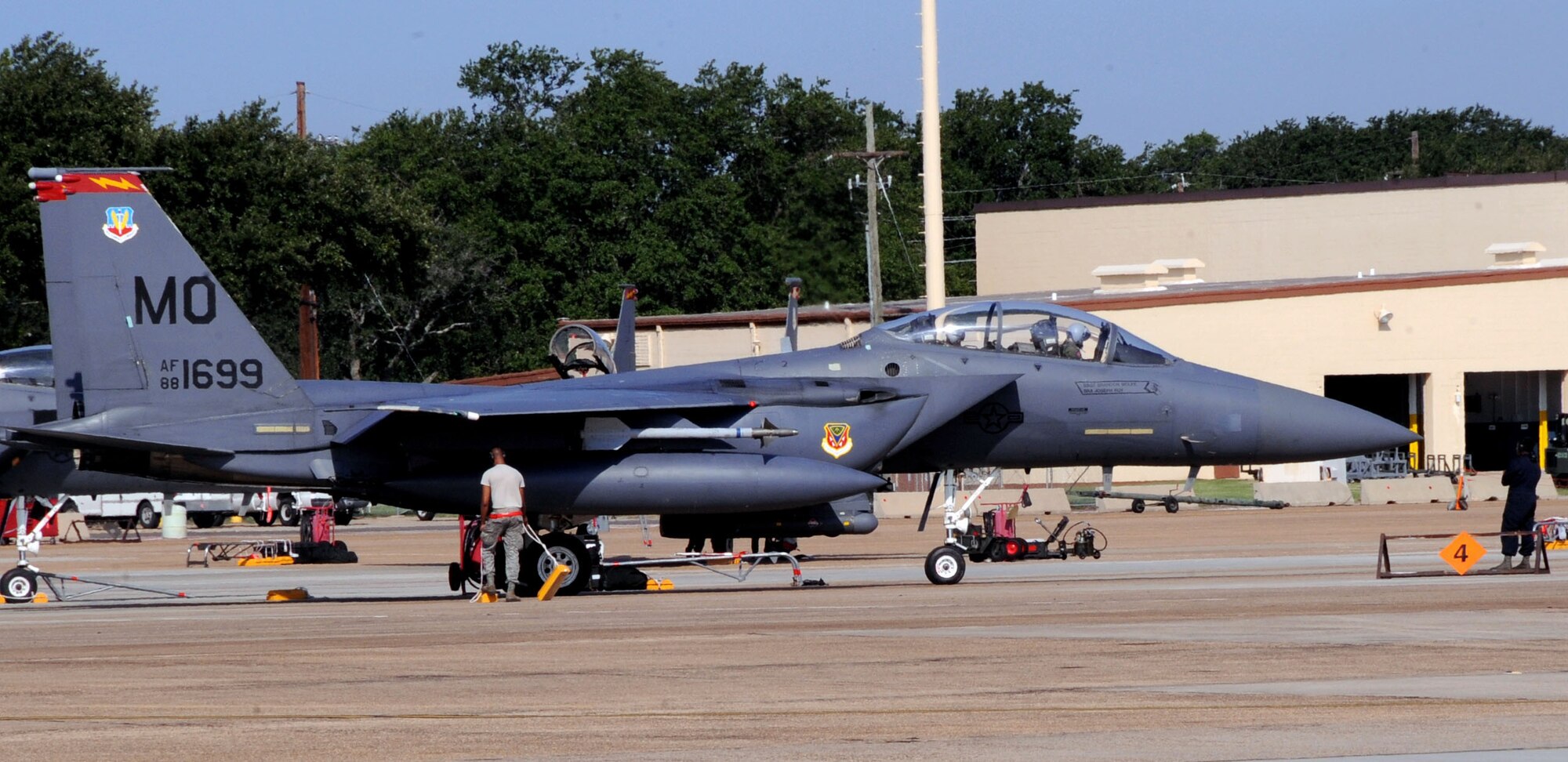Airmen from the 389th Fighter Squadron, Mountain Home Air Force Base, Idaho, prepare an F-15E Strike Eagle to taxi on Barksdale Air Force Base, La., Aug. 13. Twelve F-15s are deployed here to participate in exercise Green Flag. The exercise trains Airmen from different career fields to work together and prepare for deployments to combat environments. (U.S. Air Force photo/Senior Airman La'Shanette V. Garrett)(RELEASED)