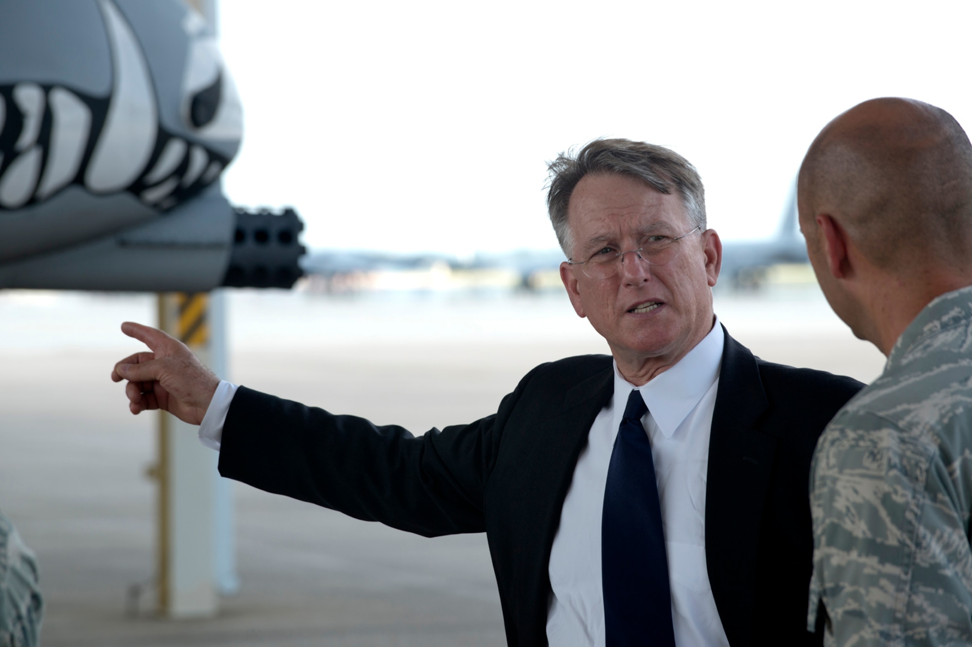 Retired U.S. Air Force Lt. Gen. John Bradley talks about his experiences flying the A-10 Thunderbolt II with U.S. Air Force Capt. Brian Plauche, 917th Aircraft Maintenance Squadron operations officer, during a visit to Barksdale Air Force Base, La., Aug. 13, 2012. From 1973 until 1985, Bradley was assigned as a pilot to the 47th Tactical Fighter Squadron at Barksdale and his name was on the side of aircraft 79-0142, which is still in service at Barksdale. (U.S. Air Force photo by Master Sgt. Greg Steele/Released)