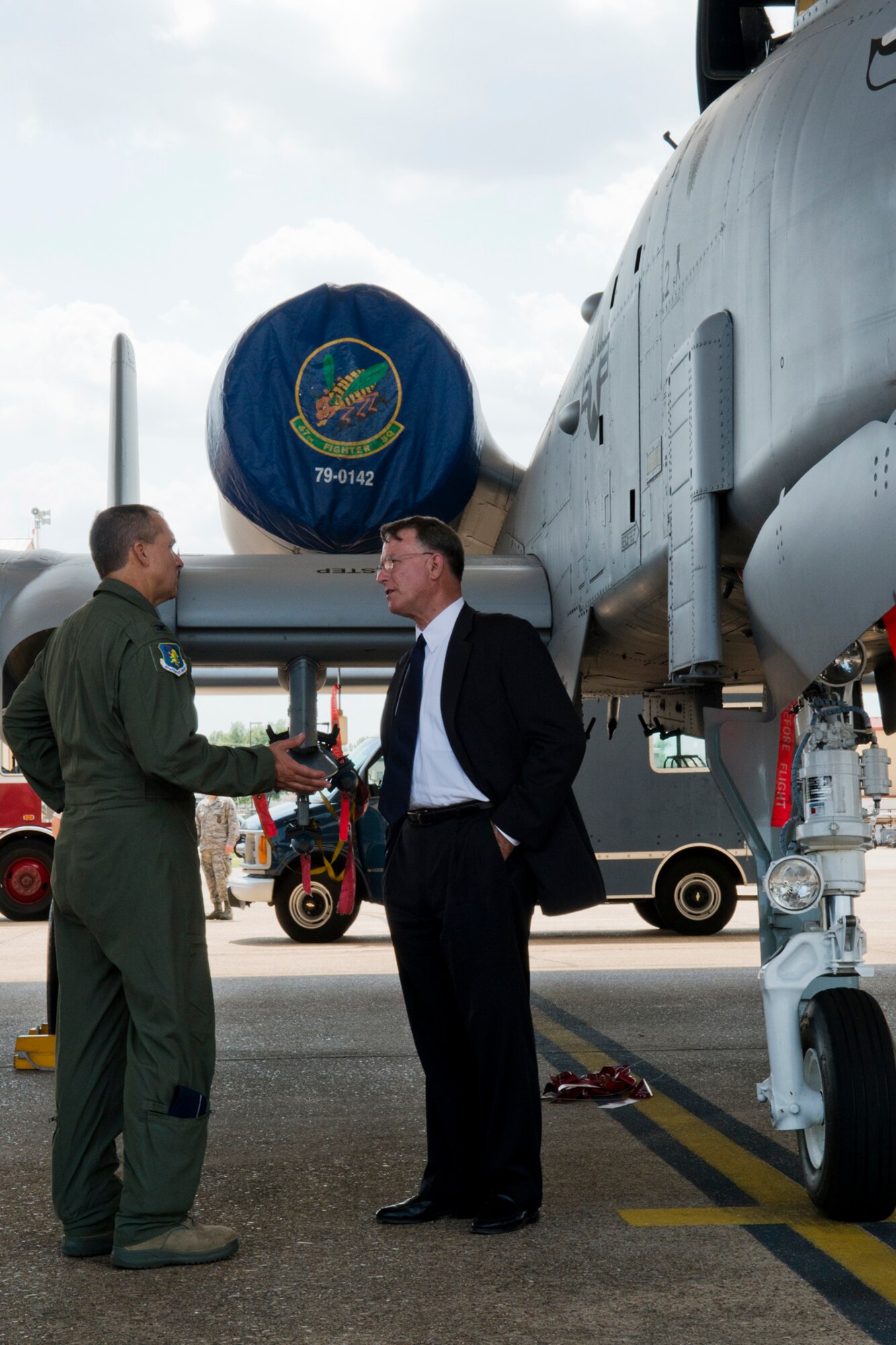 U.S. Air Force Col. John Breazeale, 917th Fighter Group commander, talks with retired Lt. Gen. John Bradley about the mission of the A-10 Thunderbolt II aircraft at Barksdale Air Force Base, La., Aug. 13, 2012. Bradley, the former commander of the Air Force Reserve Command, was assigned to Barksdale from 1973 to 1985 and flew the A-10 while a pilot for the 47th Fighter Squadron. (U.S. Air Force photo by Master Sgt. Greg Steele/Released)