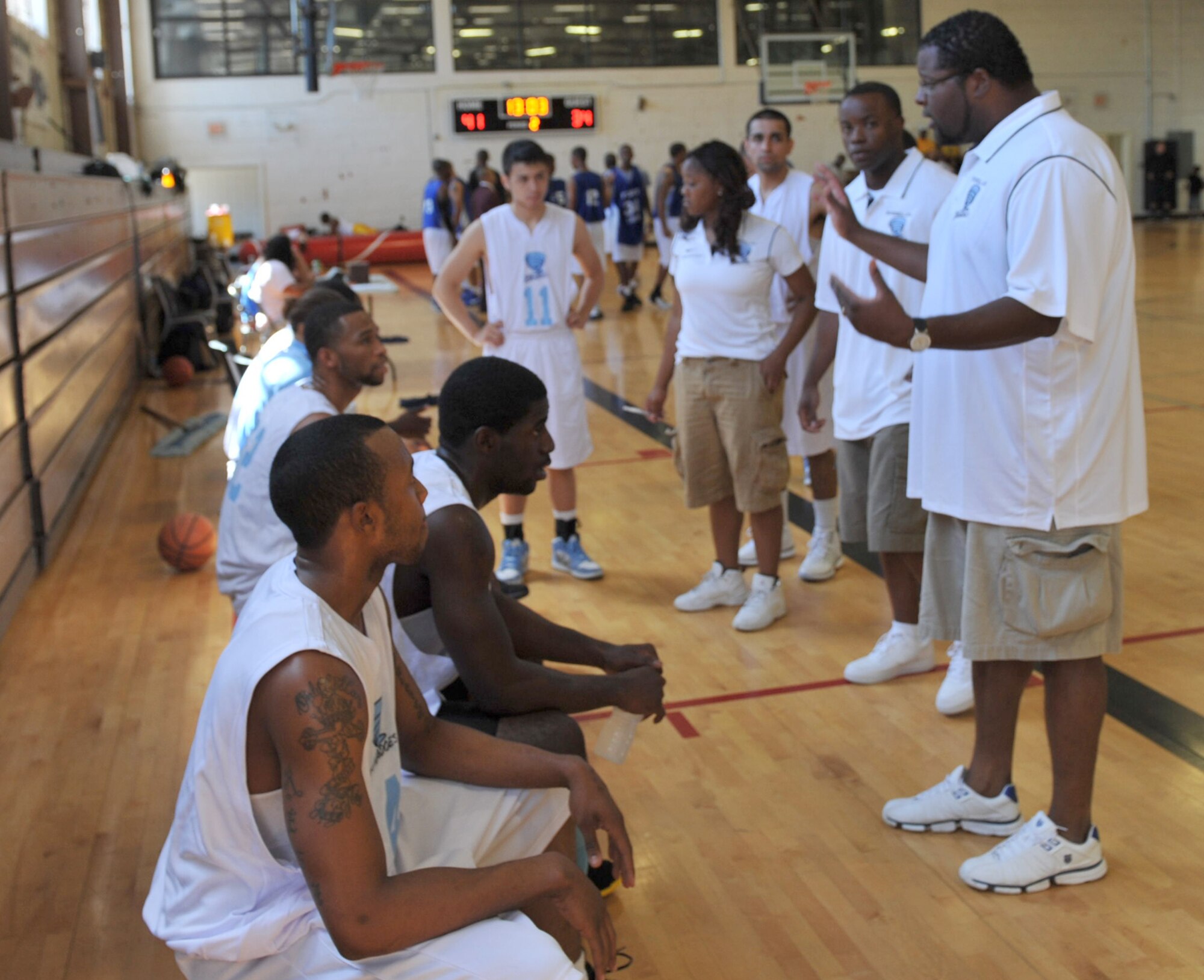 Glenn Johnson, 22nd Contracting Squadron contract specialist/business advisor, and head coach, coaches the McConnell Tornadoes during a basketball tournament Aug. 5, 2012, Fort Riley, Kan.  The Tornadoes represented McConnell while competing against three Army teams in preparation for the upcoming season. (U.S. Air Force photo/Airman 1st Class Maurice A. Hodges)