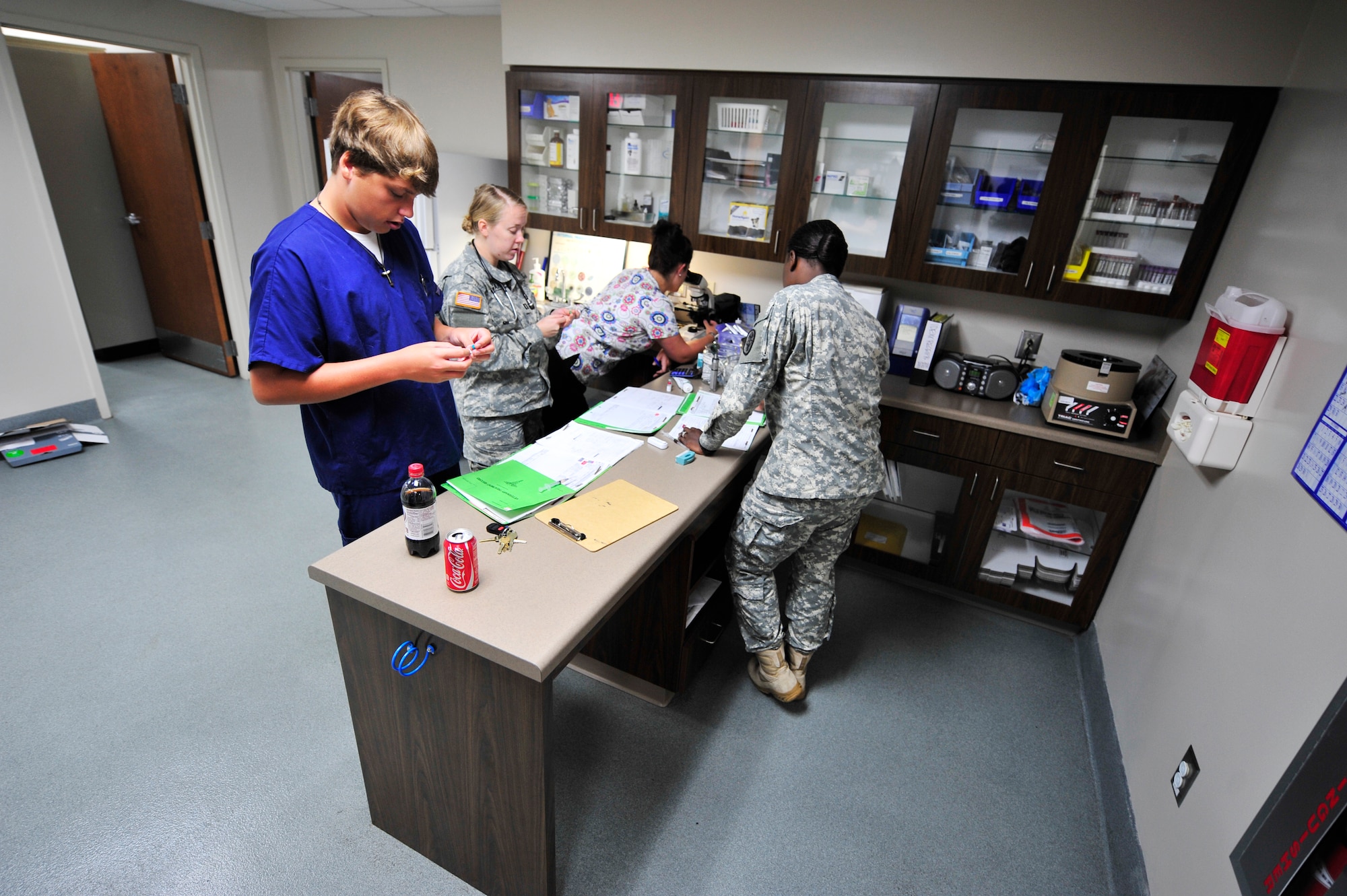 U.S. Army Soldiers and volunteers prepare medication for pets at the veterinary services, Shaw Air Force Base, S.C., Aug. 8, 2012.  The clinic currently has 2,500 active patient records and has been open since Feb. 2011.(U.S. Air Force photo by Airman Nicole Sikorski/Released)