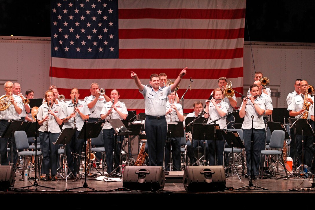 Lieutenant Daniel W. Boothe salutes America with our National March, the “Stars and Stripes Forever” on July 4th. (U.S. Air Force photo/TSgt Leo Smith)