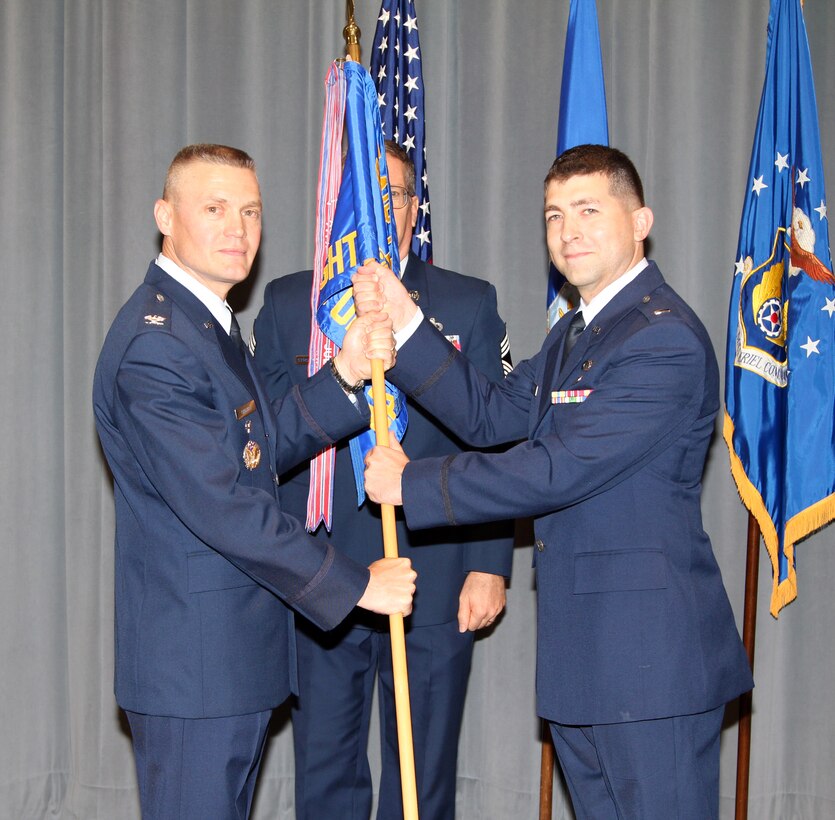 Lieutenant Daniel W. Boothe takes command of the Band of Flight from AFMC Chief of Staff, Colonel Walter Lindsley. (U.S. Air Force photo/SSgt Leo Smith)