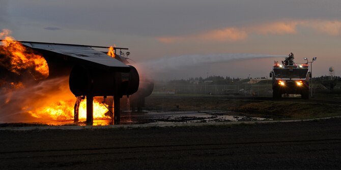 Fairchild firefighters put out a simulated aircraft fire at Fairchild Air Force Base, Wash., July 10, 2012. The Fire Department is able to simulate various aircraft and fuel spill fires. (U.S. Air Force photo/Airman 1st Class Ryan Zeski) 

