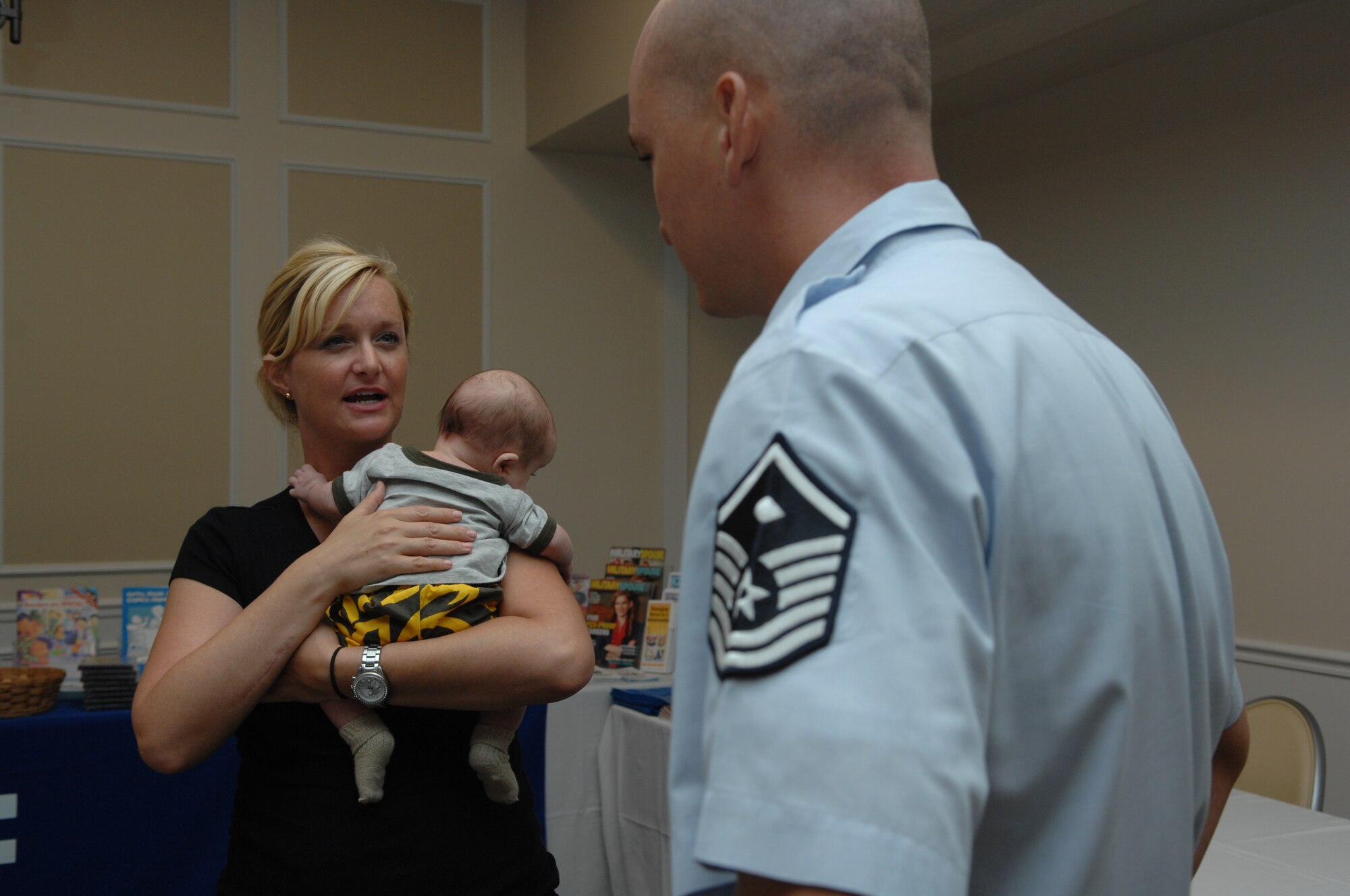 1st Lt. Renea Skelton, 20th Force Support Squadron, speaks with Master Sgt. Micki Kistler, 20th Fighter Wing Staff 1st Sgt., at the Deployed Spouses Dinner, Shaw AFB, S.C. Aug. 13.  More than 200 attended this event sponsored by chapel services. (U.S. Air Force Photo by Staff Sgt. Ave I. Young/Released)