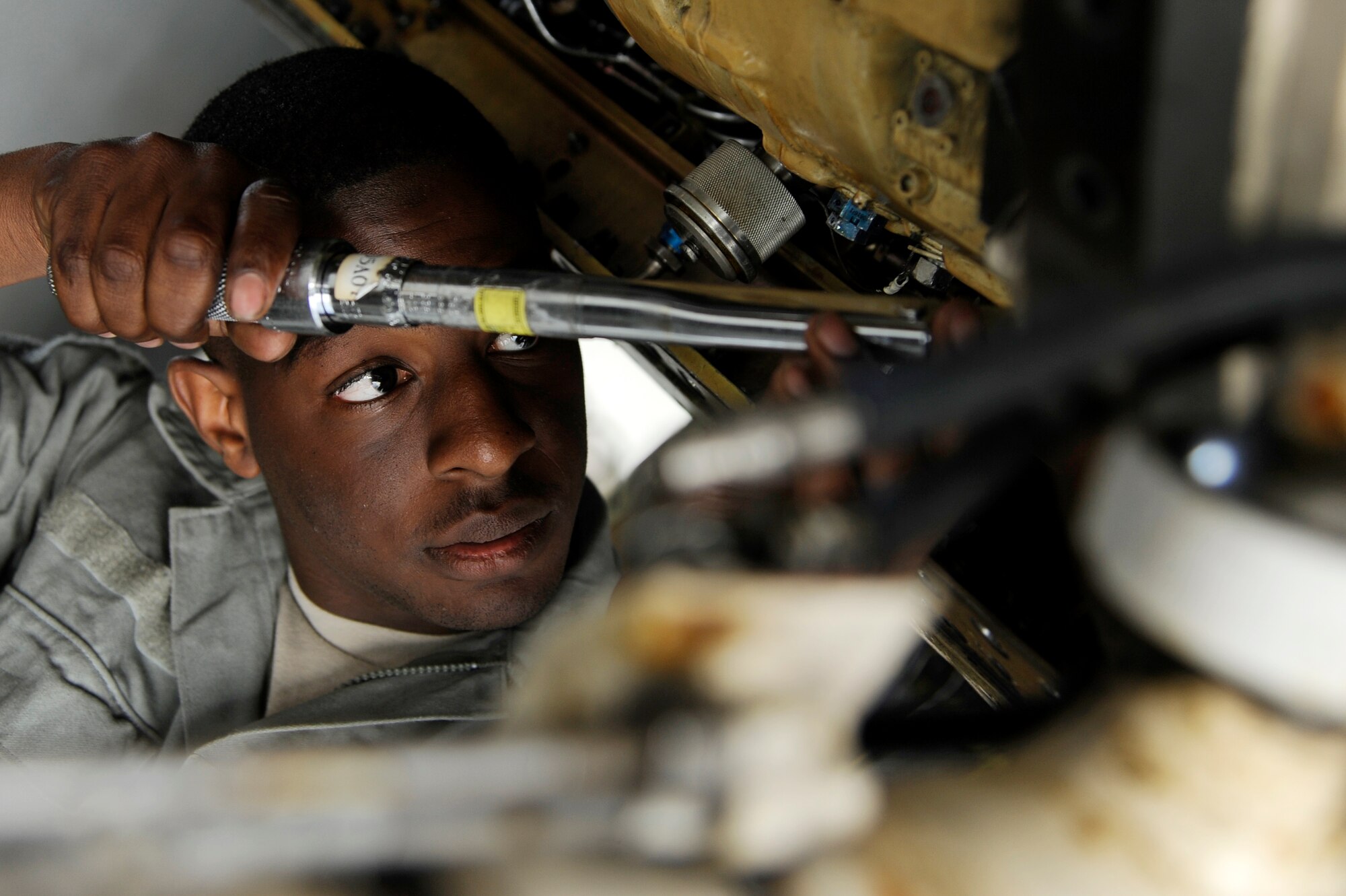 U.S. Air Force Airman 1st Class Ivan Williams, 13th Aircraft Maintenance Unit electrical and environmental specialist from Misawa Air Base, Japan, installs  a main generator to an F-16 Fighting Falcon during RED FLAG-Alaska 12-3 Aug. 10, 2012, Eielson Air Force Base, Alaska.  When units deploy to RF-A, maintainers must perform all aircraft maintenance, being as self-sufficient at Eielson as they would be in a wartime environment. (U.S. Air Force photo/Staff Sgt. Jim Araos)