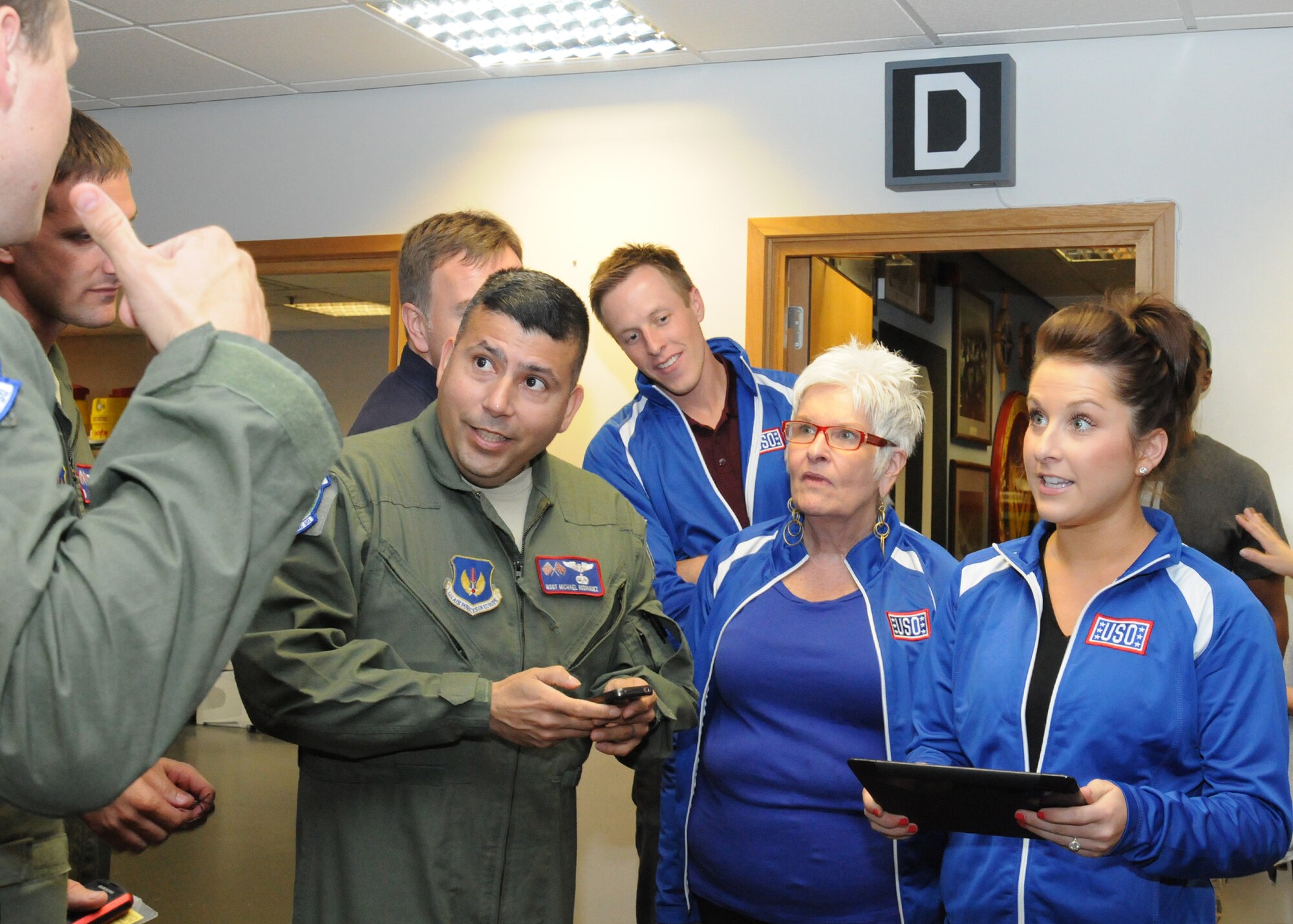 RAF MILDENHALL, England – Carly Patterson, Olympic gold medalist and singer, speaks with members of the 351st Air Refueling Squadron Aug. 13, 2012, while visiting the squadron as part of a United Services Organizations tour at RAF Mildenhall. Patterson was at the base for the day to meet Service members and their families as well as provide gymnastics classes for children at the youth center. (U.S. Air Force photo/Tech. Sgt. Neal X. Joiner)
