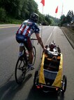 Ryan Creel, left, and Glenn Isaac Fretz, both veteran riders on the Long Road Home project, help each other down the road. They were two of five riders cycling across the nation hoping to promote inspiration and awareness for the veterans throughout the United States. (U.S. Air Force courtesy photo)