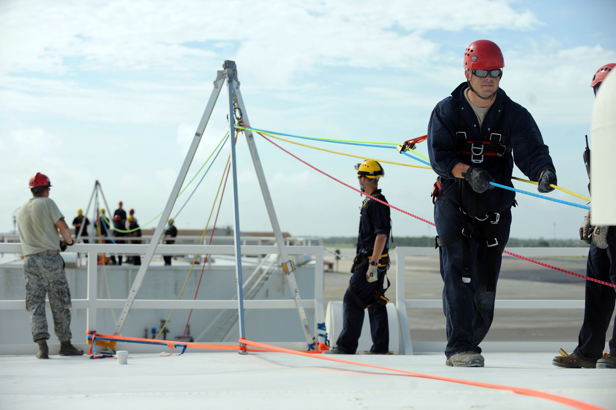 Staff Sgt. Daniel Harper-Staub, 6th Civil Engineer Squadron firefighter crew chief, tensions the highline to prepare for a high-angle rescue operation during the Rescue Technician I course Aug. 6, 2012, at MacDill Air Force Base, Fla. The lines were used to lower a firefighter to "rescue" a dummy 50 feet below. (U.S. Air Force photo/Senior Airman Rachelle Coleman)
