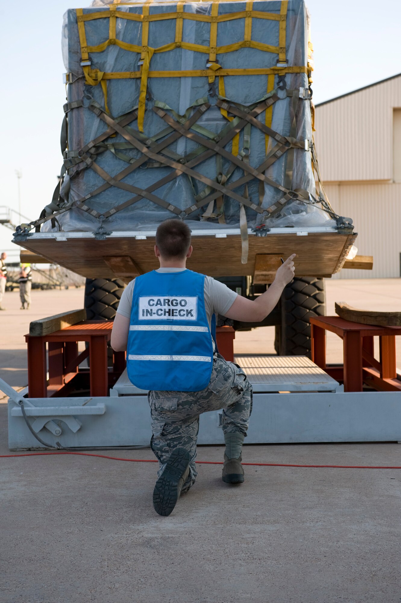 Airman 1st Class Zachary West, 7th Logistics Readiness Squadron, directs a cargo pallet onto a weight scale during an Operational Readiness Exercise Aug. 10, 2012, at Dyess Air Force Base, Texas. Processing cargo quickly and accurately is a vital part of getting the equipment where it needs to be. Airmen from the 7th Bomb Wing ensure cargo is weighed properly, secured and safe before it is loaded onto an aircraft. (U.S. Air Force photo by Staff Sgt. Richard P. Ebensberger/ Released)