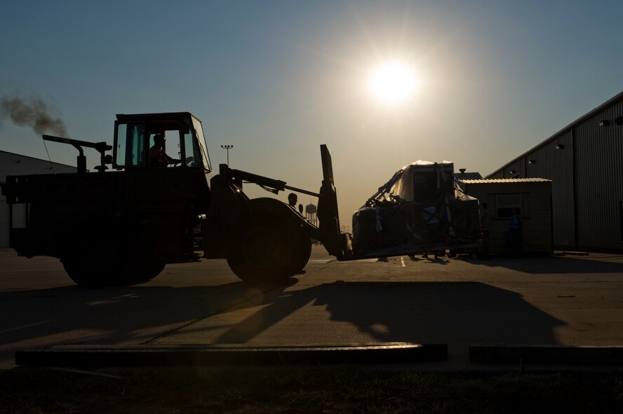 An Airman from the 7th Logistics Readiness Squadron transports a cargo pallet during an Operational Readiness Exercise Aug. 10, 2012, at Dyess Air Force Base, Texas. Processing cargo quickly and accurately is a vital part of getting the equipment where it needs to be. Airmen from the 7th Bomb Wing ensure cargo is weighed properly, secured and safe before it is loaded onto an aircraft. (U.S. Air Force photo by Staff Sgt. Richard P. Ebensberger/ Released)
