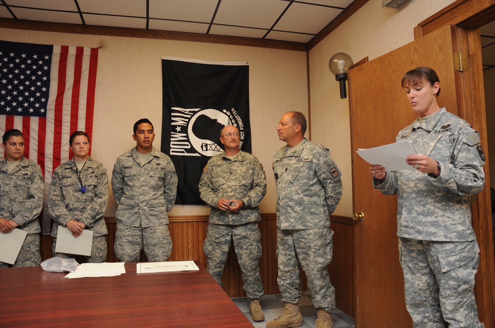 The South Dakota National Guard recognized several Airmen for their support to the South Dakota National Guard and the Golden Coyote 2012 exercise at the 28th Munitions Squadron storage building on Ellsworth Air Force Base, S.D., Aug. 8, 2012.  The work of these Airmen allowed the South Dakota National Guard, as well as over 1,700 participants from five countries and 35 different units during Golden Coyote 2012, to train effectively for future combat missions.  (U.S. Air Force photo by Airman 1st Class Anania Tekurio/Released)  