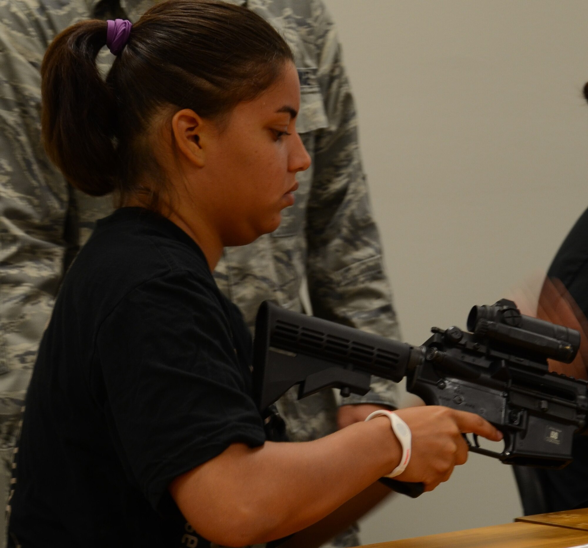 Trainees in the Development and Training Flight learn how to assemble and disassemble an M-4 during their initial weapons familiarization course here on Aug. 4. The D&TF program was established to better prepare new recruits for Air Force Basic Military Training. (U.S. Air Force photo/Senior Airman Natasha Dowridge)