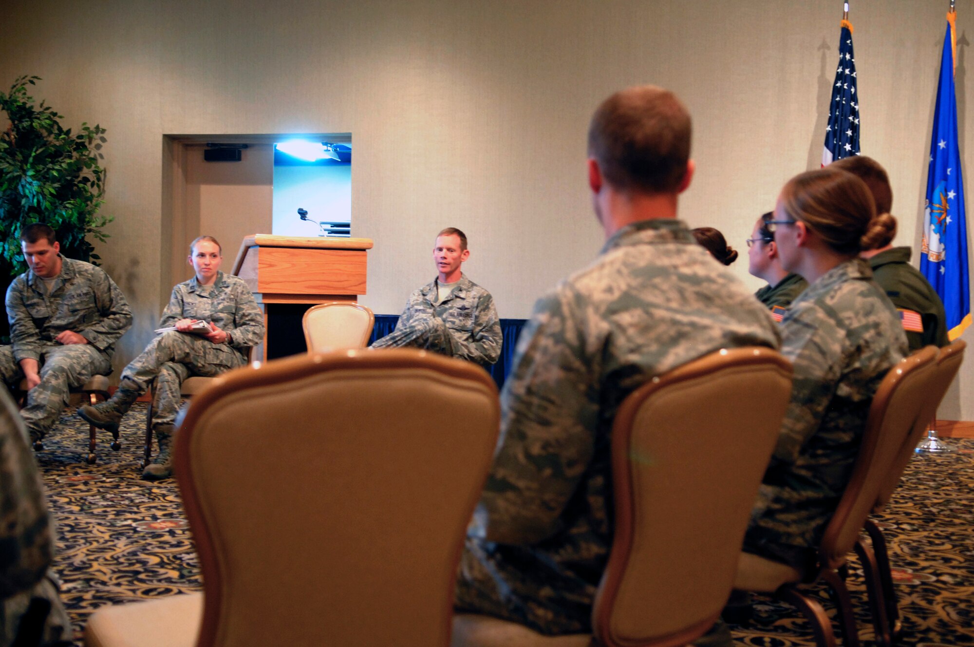 MINOT AIR FORCE BASE, N.D. -- Col. James Dawkins Jr., 5th Bomb Wing commander, speaks with company grade officers during one of their organizational meetings at the Jimmy Doolittle Center Aug. 10. Among many other reasons, Team Minot's CGOs meet to promote professional development among the base's junior officers. (U.S. Air Force photo/2nd Lt. Jose Davis)