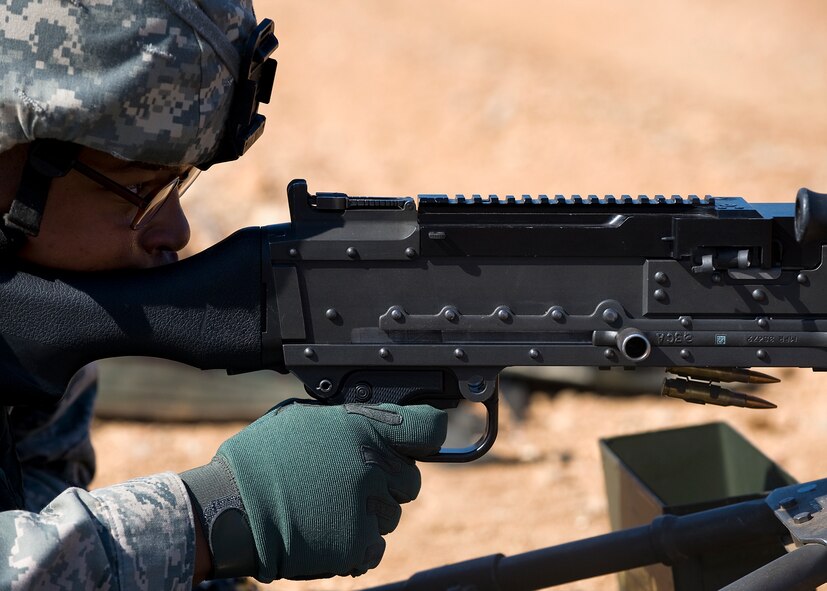 Airman 1st Class Raymond Thompkins, fires a M240 machine gun Aug. 10, 2012, during a heavy weapons qualification course at Camp Bowie, Texas. While at the firing range, Airmen assigned to the 7th Security Forces Squadron shot a M240 machine gun at targets ranging from 25 to 300 meters. The M240 allows servicemembers to place mass amount of fire on an enemy position, suppressing their movement. Prior to firing at the range, Airmen participate in a four-day classroom course, where they learn how to clean, disassemble, reassemble, operate, perform immediate actions and about different types of loads for the weapon.  (U.S. Air Force photo by Airman 1st Class Damon Kasberg/Released)
