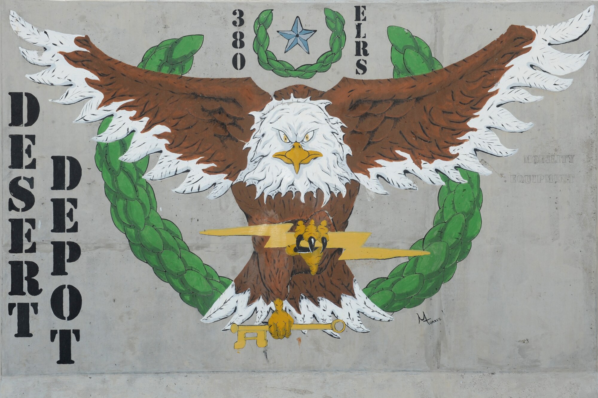 SOUTHWEST ASIA - The 380th Expeditionary Logistics Readiness Squadron's Desert Depot T-wall bears the image of a falcon. The Desert Depot T-wall underwent a touch-up Aug. 14, 2012.  (U.S. Air Force photo/Master Sgt. Scott MacKay)