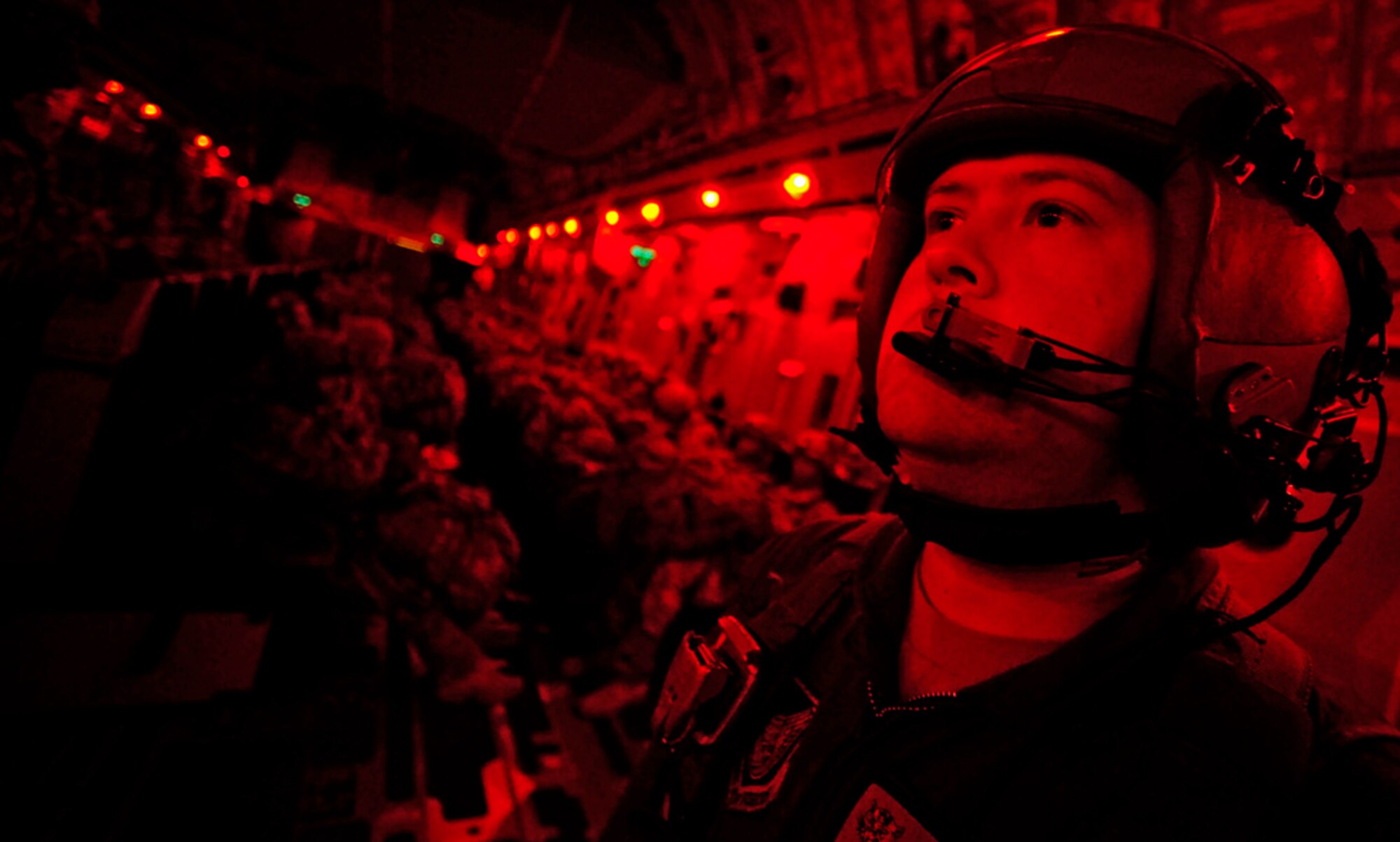 Staff Sgt. Lucas Crumpton waits for the "go" signal before an airborne insertion during Joint Forcible Entry Exercise Sept. 14, 2010, at Pope Air Force Base, N.C. The exercise is a training event held six times a year in order to enhance cohesiveness between the Air Force and Army by executing large scale, heavy equipment and troop movement for real-world contingencies. Crumpton is a C-17 Globemaster III loadmaster with the  535th Airlift Squadron from Hickam Air Force Base, H.I. (U.S. Air Force photo/Staff Sgt. Angelita M. Lawrence)