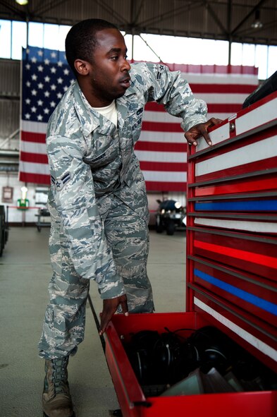 SPANGDAHLEM AIR BASE, Germany – Airman 1st Class Joshua Green, 81st Aircraft Maintenance Unit weapons load crew member, closes a toolbox drawer during a weapons load competition here Aug. 10.  The 480th and 81st AMUs host and participate in the timed competition once a quarter to see which unit has the fastest and most efficient weapons load crew.  The winners of the competition earn bragging rights as the best crew and a trophy. (U.S. Air Force photo by Airman 1st Class Gustavo Castillo/Released)