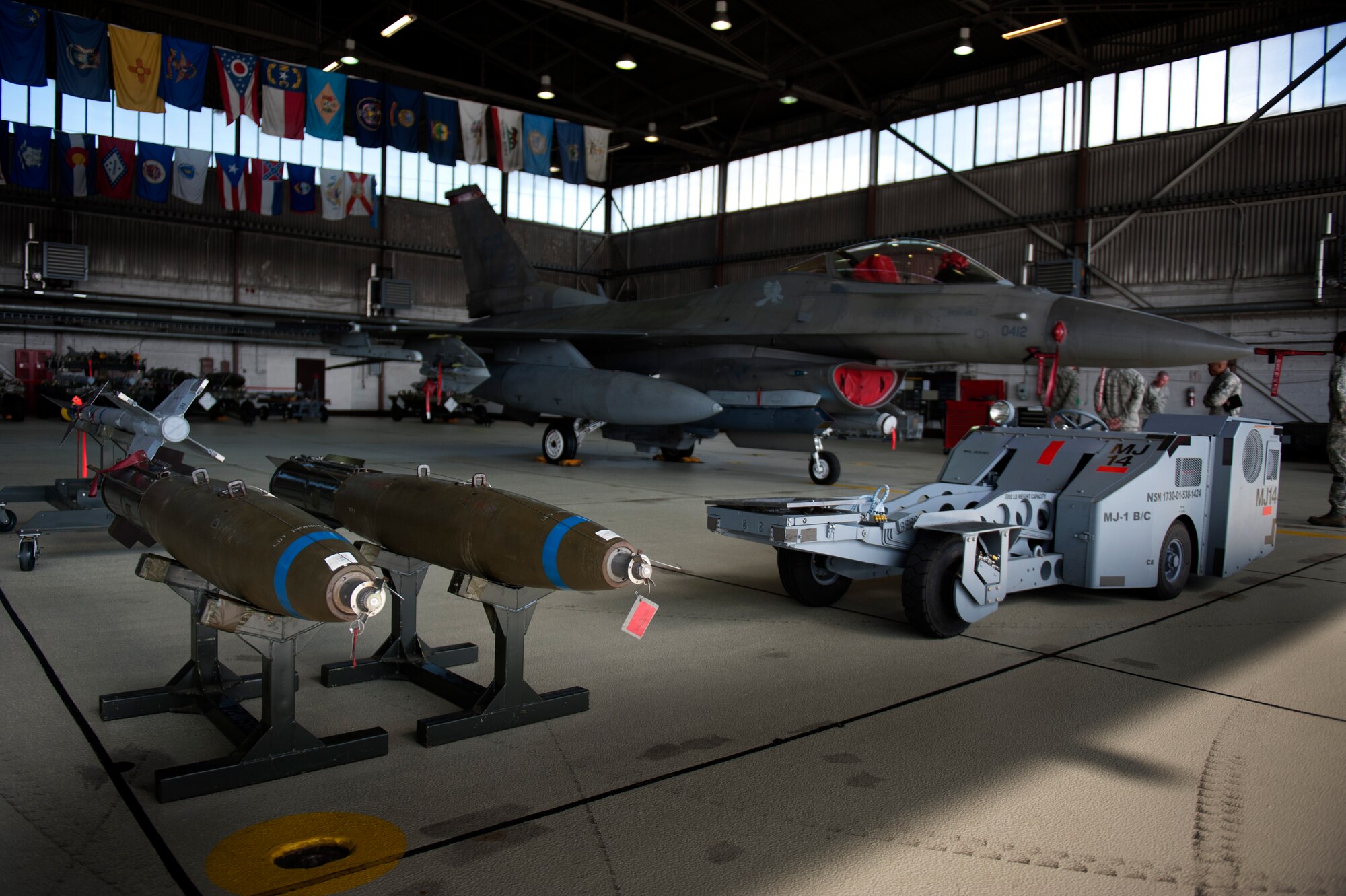 SPANGDAHLEM AIR BASE, Germany – An F-16 Fighting Falcon is parked in a hangar during a weapons load competition here Aug. 10.  The 480th and 81st AMUs host and participate in the timed competition once a quarter to see which unit has the fastest and most efficient weapons load crew.  The winners of the competition earn bragging rights as the best crew and a trophy. (U.S. Air Force photo by Airman 1st Class Gustavo Castillo/Released)