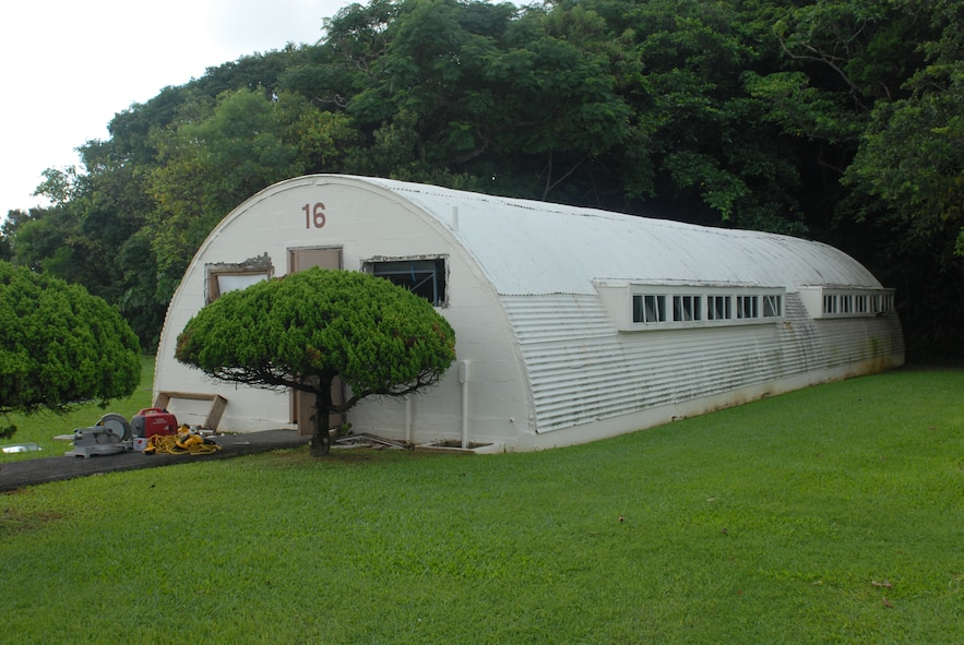 Building 16, also known as a Quonset hut, was built in 1946 and was moved to its current site in 1986, next to the 18th Wing headquarters building on Kadena Air Base, Japan, Aug. 8, 2012. Quonset huts were a renovation of a World War I design from the British and were introduced in the 1940’s. The 18th Civil Engineering Squadron partnered with the 18th Wing History office to restore the building as a project to help preserve the last Quonset hut on Kadena. (U.S. Air Force photo/Airman 1st Class Hailey R. Davis)