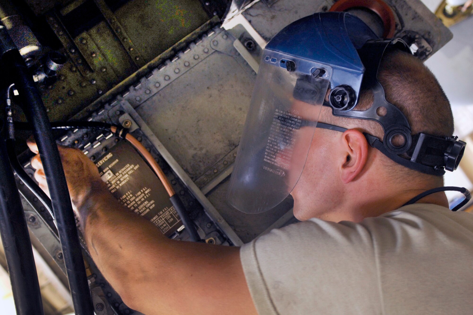 SrA William Fine, an aircraft maintenance technician assigned to the 455th Expeditionary Aircraft Maintenance Squadron, adjusts the bootstrap accumulator on an A-10 Thunderbolt II during a seven-level inspection at Bagram Airfield, Afghanistan, Aug, 9, 2012. Each time an A-10 accomplishes 500 flying hours, the maintainers put the aircraft through a periodic maintenance phase which lasts approximately four to five days. During this time, the maintainers give the aircraft a complete overhaul, looking for foreign object debris, damage, cracked or worn parts. They also ensure that every section of the airframe is intact with each piece in place. (U.S. Air Force photo/SSgt Jeff Nevison)