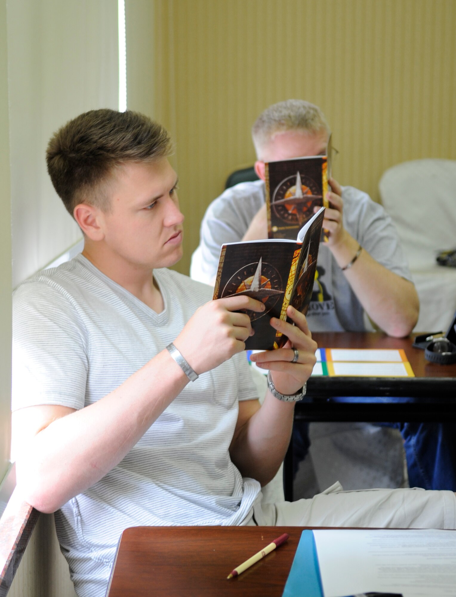 Capt. Carl Corvin, 8th Mission Support Group from Kunsan Air Base, Republic of Korea, reads about personality types during a marriage retreat hosted at Yongsan Garrison, Aug. 11, 2012, by the Kunsan Chapel. Airmen learned the importance of taking their spouse’s personality into account when solving and talking through problems. (U.S. Air Force photo/Senior Airman Brigitte N. Brantley)