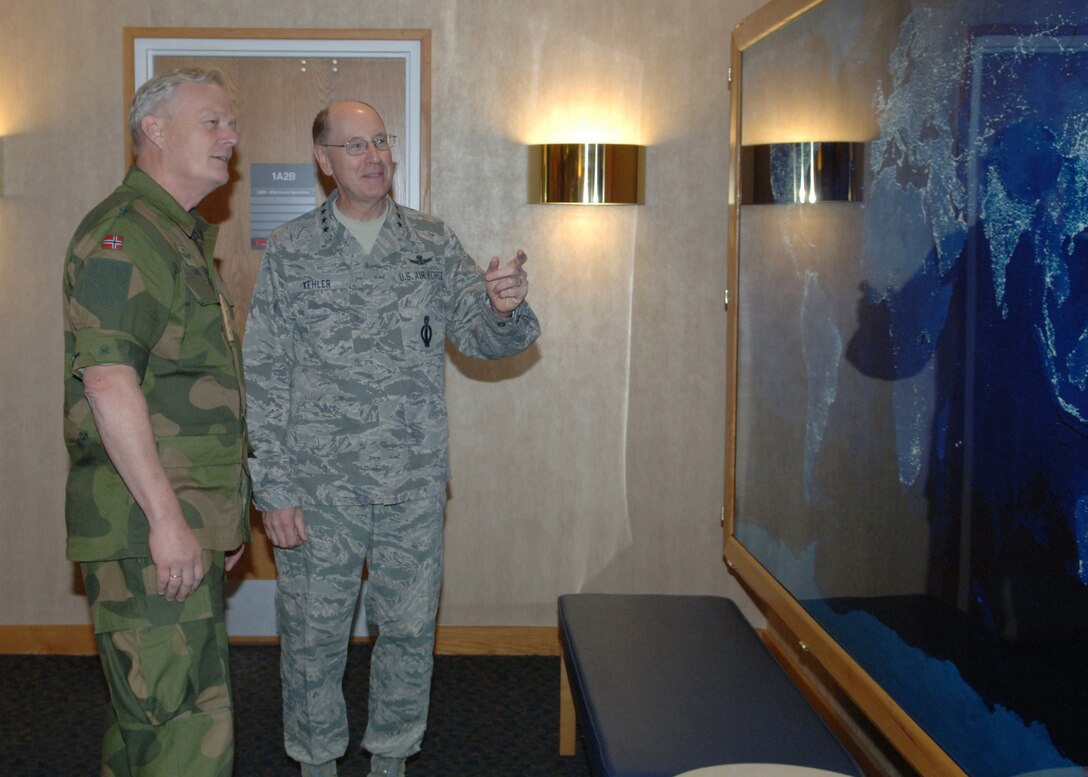 Gen. C. Robert Kehler, commander of U.S. Strategic Command, speaks with Gen. Harald Sunde, Chief of Defence, Norway during an August 14, 2012 visit to the headquarters command located at Offutt Air Force Base, Neb.  During his visit, Gen. Sunde toured an RC-135 aircraft, along with the Airborne National Command Post and STRATCOM Headquarters building.