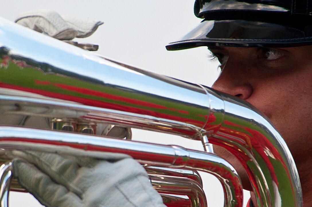 Sgt. David Cox, Marine Drum & Bugle Corps first baritone section leader, performs during a Tuesday Sunset Parade at the Marine Corps War Memorial in Arlington, Va., Aug. 14.