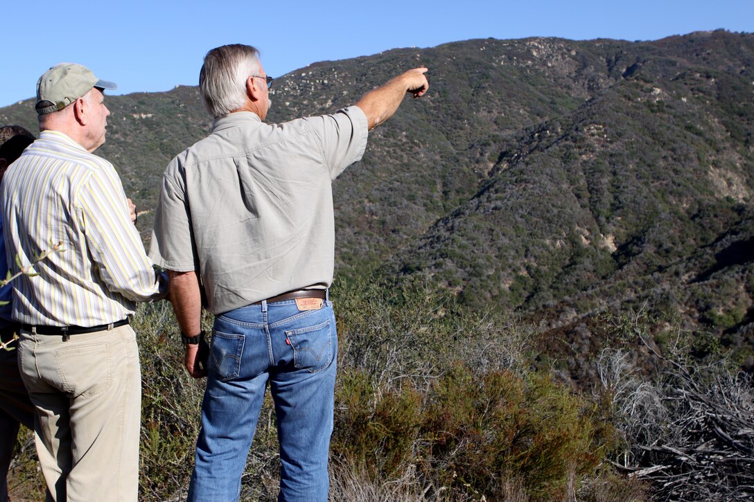 Robert Durling from Durling Nursery Inc. and Mike Peters from the Fallbrook Land Conservancy exam the land obtained by the Readiness and Environmental Protection Initiative project, which closed escrow on August 14. The REPI supports cost-sharing partnerships authorized by Congress between the military services, private conservation groups, and state and local governments to protect military test and training capabilities and wildlife habitats.