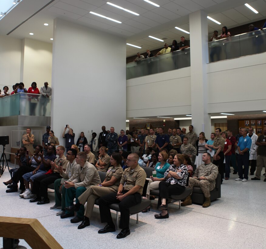 Dozens of service members, their families and other employees listen intently as Herschel Walker gives a speech at Naval Hospital Camp Lejeune aboard Marine Corps Base Camp Lejeune. Walker talks about his own battle with mental health issues and encourages those dealing with the similar problems to seek help. 