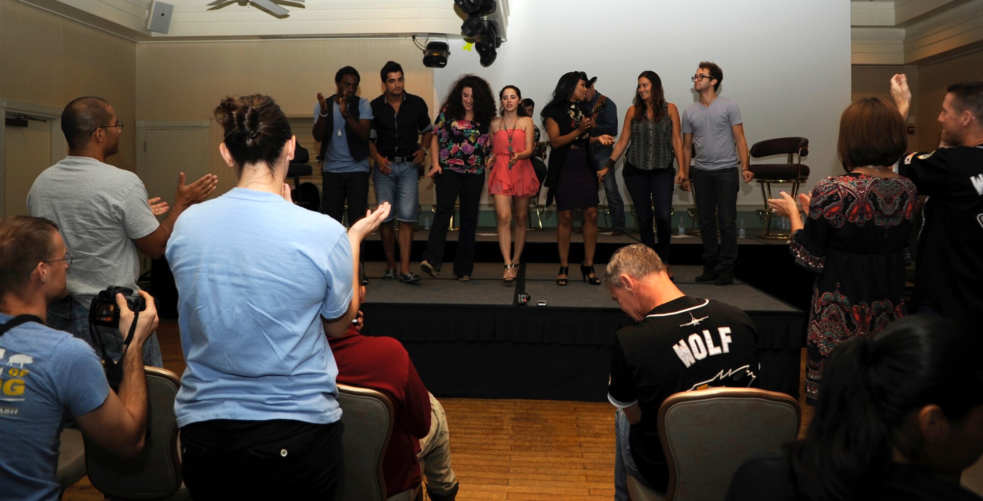 Singers with the “Idols World Tour” entertain the audience at Kunsan Air Base, Republic of Korea, Aug. 15, 2012. The performers thanked Wolf Pack Airmen for the sacrifices they make on a daily basis serving away from loved ones. (U.S. Air Force photo/Senior Airman Brigitte N. Brantley)