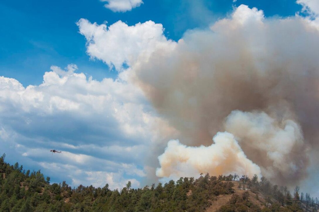 Two HH-60G Pave Hawk helicopters from the 129th Rescue Wing are battling the Jawbone Complex Fire in Kern County, Calif. The aircraft have been based out of the Tehachapi Municipal Airport in Tehachapi, Calif. since Sunday, Aug. 12. (Air National Guard photo/Master Sgt. Julie Avey)
