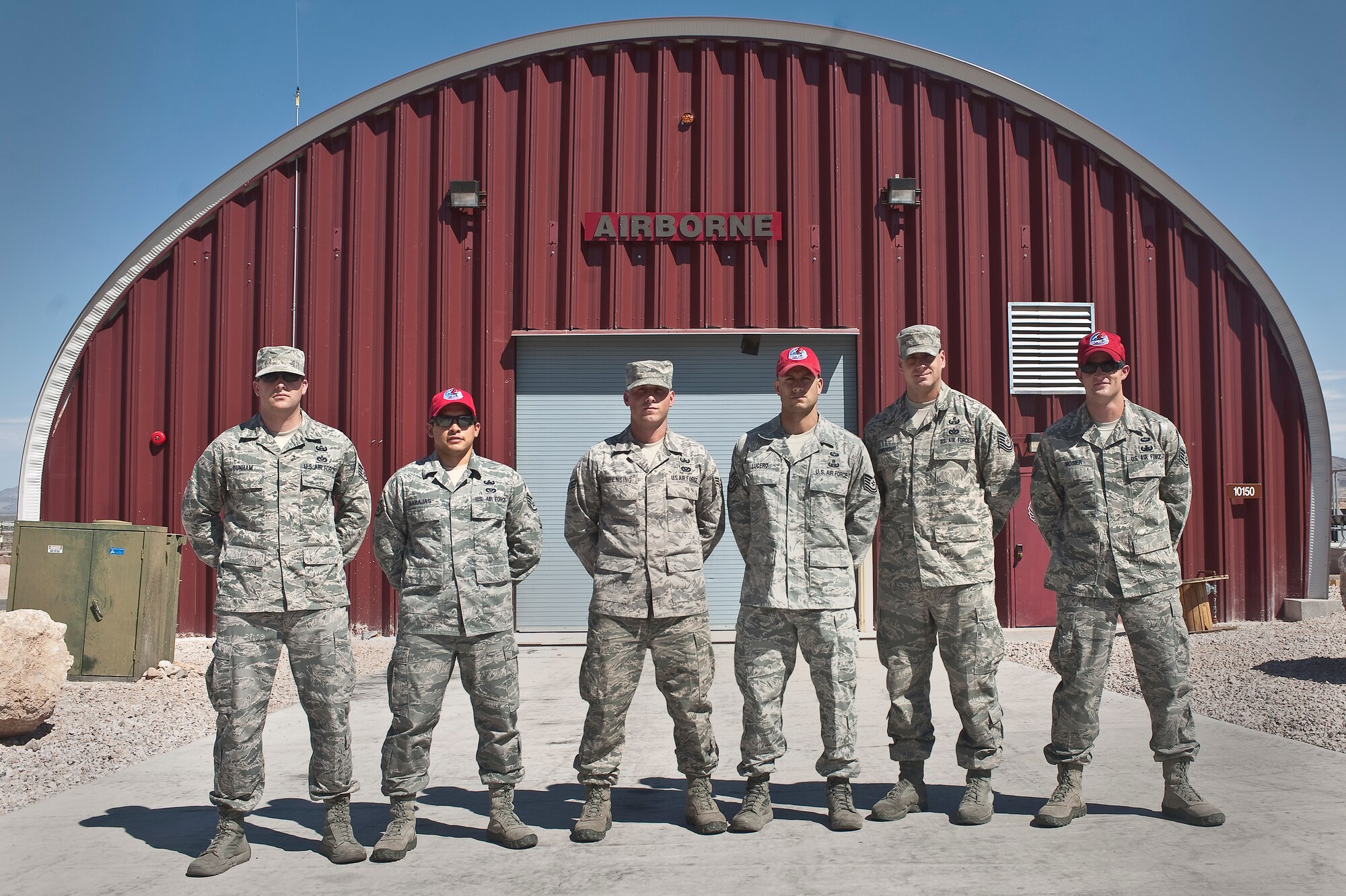U.S. Air Force explosive ordnance disposal team members of the 820th  RED HORSE airborne flight, pose for a group photo Aug. 10, 2012, at Nellis Air Force Base, Nev. Airborne EOD members are trained and qualified to conduct operations in austere locations. (U.S. Air Force photo by Staff Sgt. Christopher Hubenthal)