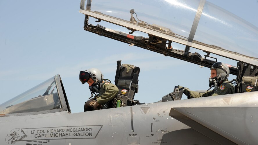 Maj. Paul Sieger and Capt. Michael Hefferly, 389th Fighter Squadron F-15E Strike Eagle pilot and weapon system operator, Mountain Home Air Force Base, Idaho, conduct pre-flight checks on their F-15E Strike Eagle on Barksdale Air Force Base, La., Aug 14. Sieger and Hefferly are preparing to fly to Fort Polk, La., to support Army units with close air support for exercise Green Flag. (U.S. Air Force photo/Airman 1st Class Andrew Moua)(RELEASED)