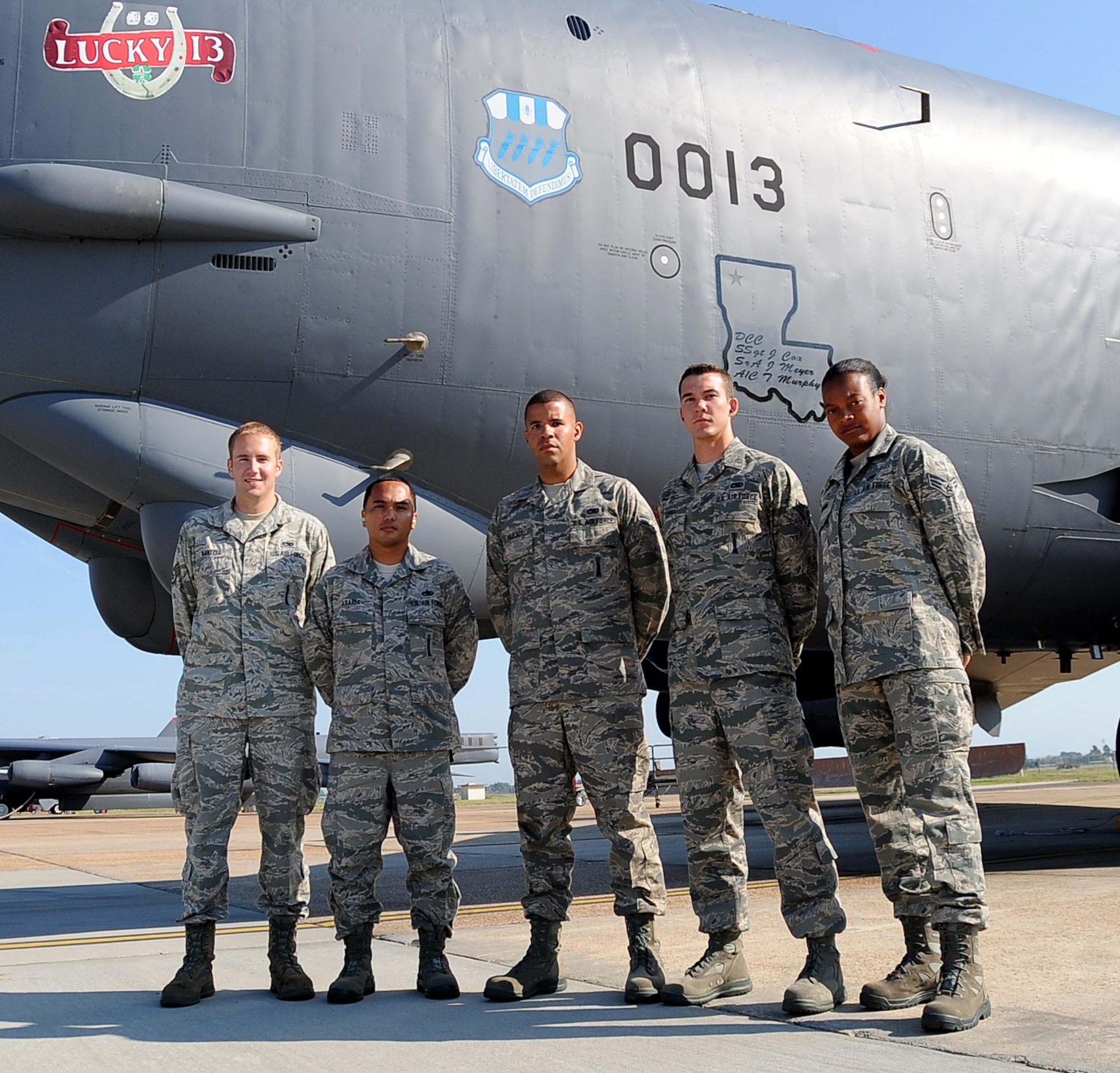 Staff Sgt. Daniel Santell poses with (from left) Tech. Sgt. Ryan Asaria, Senior Airman Matthew Wallace, Airman 1st Class Carl Scholl and Senior Airman Kayla Hopkins on the flightline at Barksdale Air Force Base, La., Aug. 14. Santell is a veteran Global Strike Challenge competitor and is helping coach Asaria, team lead for the nuclear/conventional load crew, and his team members for this year?s annual Air Force Global Strike Command challenge. (U.S. Air Force photo/Staff Sgt. Amber Ashcraft)(RELEASED)