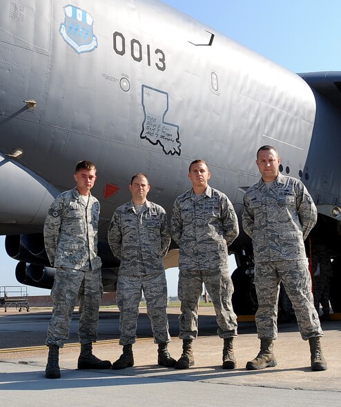 (From left) Staff Sgt. Jason Edwards and Staff Sgt. Matthew Dennis pose with Senior Airman James Lawson and Tech. Sgt. Michael Bayne on the flightline at Barksdale Air Force Base, La., Aug. 14. Edwards and Dennis are veteran Global Strike Challenge crew chiefs and are helping coach Lawson and Bayne for this year's annual Air Force Global Strike Command challenge. (U.S. Air Force photo/Staff Sgt. Amber Ashcraft)(RELEASED)