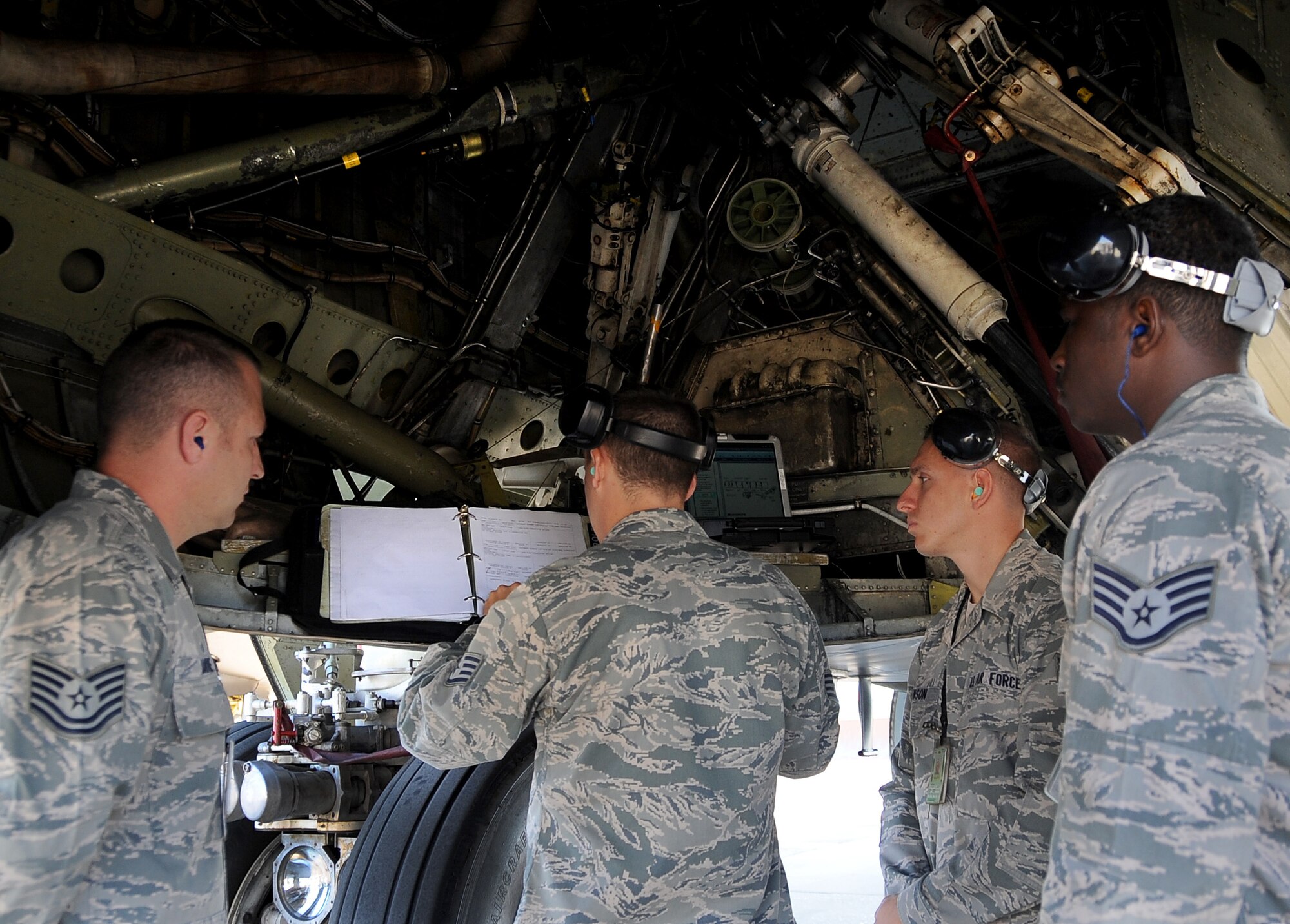 Members from the 2nd Maintenance Squadron review pre-flight checklists on the flightline at Barksdale Air Force Base, La., Aug. 14. Barksdale is training for the annual Global Strike Challenge, hosted by Air Force Global Strike Command. Four Airmen will compete as the nuclear/conventional load crew and two will be the dedicated crew chiefs for the competition. (U.S. Air Force photo/Staff Sgt. Amber Ashcraft)(RELEASED)