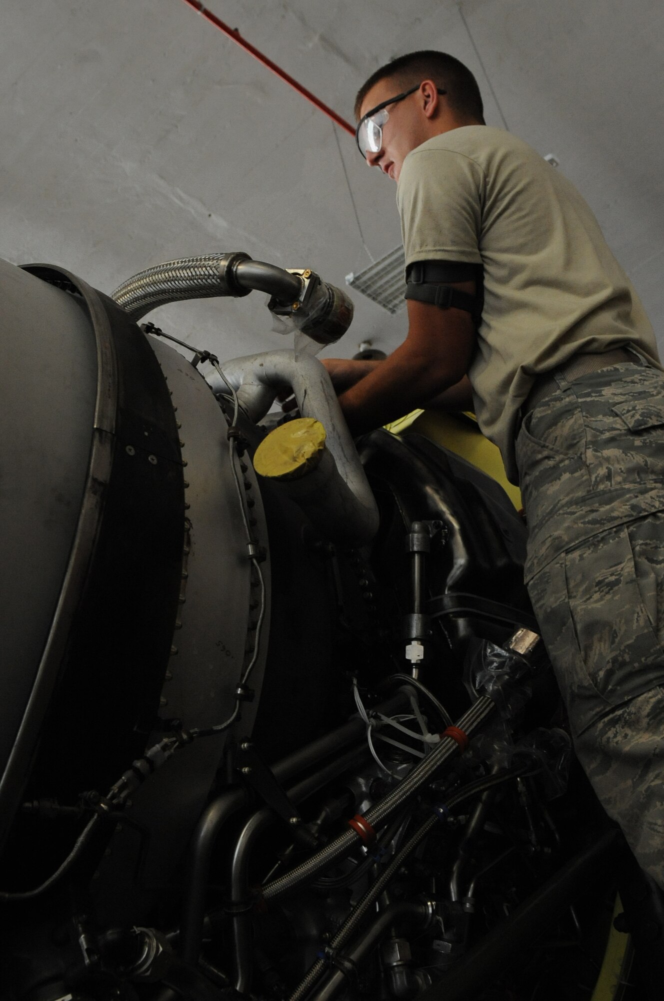 Senior Airman Colton Chandler, 2nd Maintenance Squadron aerospace propulsion craftsman, installs an air duct for a TF33/P-103 turbofan engine on Barksdale Air Force Base, La., Aug. 13. When a refurbished engine arrives from the Maintenance Depot at Tinker AFB, Okla., propulsion Airmen must install key components so the engine is ready to be mounted on a B-52H Stratofortress when needed. (U.S. Air Force photo/Airman 1st Class Micaiah Anthony)(RELEASED)