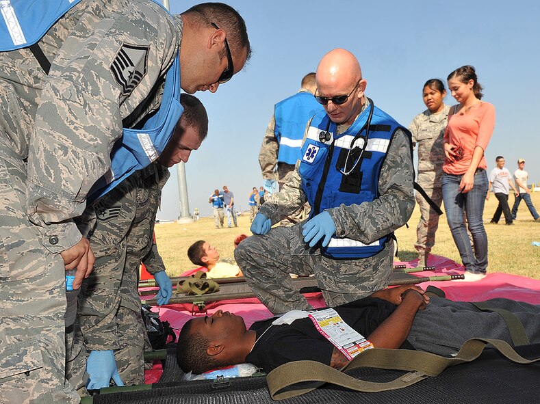 Capt. Brian Jamail, 22nd Aerospace Medicine Squadron physician assistant, assesses a “victim’s” injuries during a major accident response exercise Aug. 15, 2012 McConnell Air Force Base, Kan. McConnell Airmen are tested frequently on their ability to respond major incidents. (U.S. Air Force photo/Airman 1st Class Maurice A. Hodges)
