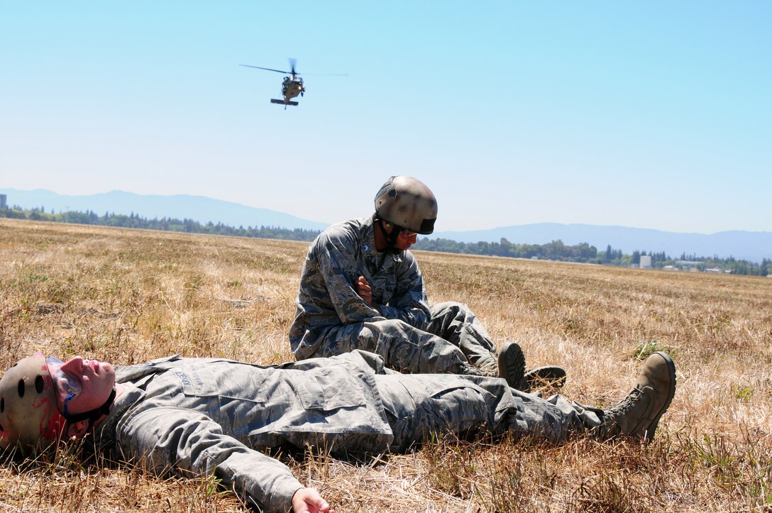 Cadets James Krasner and Jay Pothula, from Massachusetts Institute of Technology ROTC program take part in medical evacuation training exercises with the 129th Rescue Wing at Moffett Federal Airfield, Calif., Aug. 8, 2012. The cadets are conducting their summer two week training; after graduation in 2014 both cadets plan on becoming pilots or combat rescue officers. (Air National Guard photo by Staff Sgt. Kim Ramirez)  