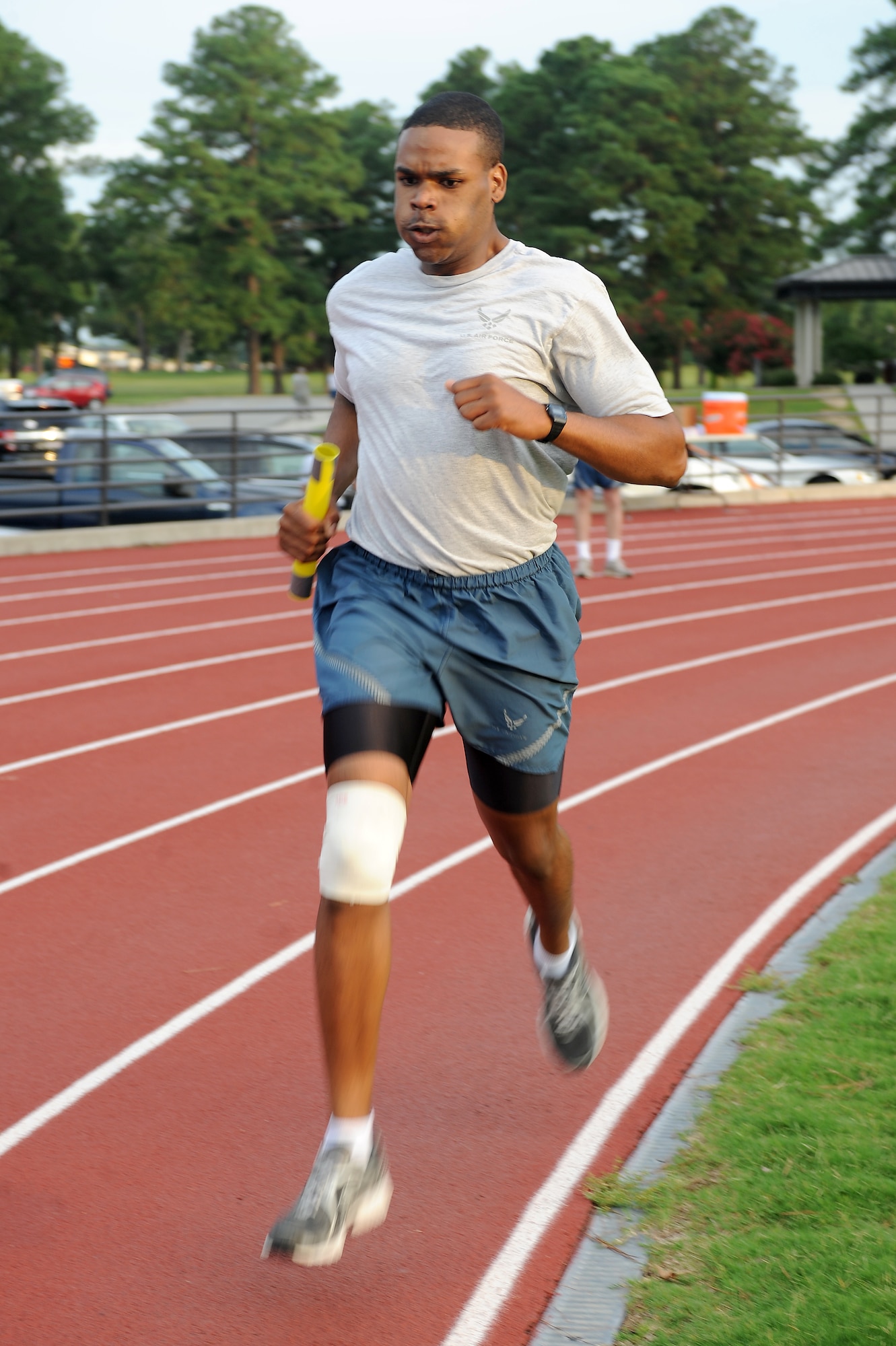 U.S. Air Force Senior Airman Kade Forrester, 4th Logistics Readiness Squadron individual protective equipment technician, sprints towards the finish line during the Beat the Heat relay run at Seymour Johnson Air Force Base, N.C., Aug. 10, 2012. The contest had four different teams with five individuals on each team. (U.S. Air Force photo/Airman 1st Class John Nieves Camacho/Released)