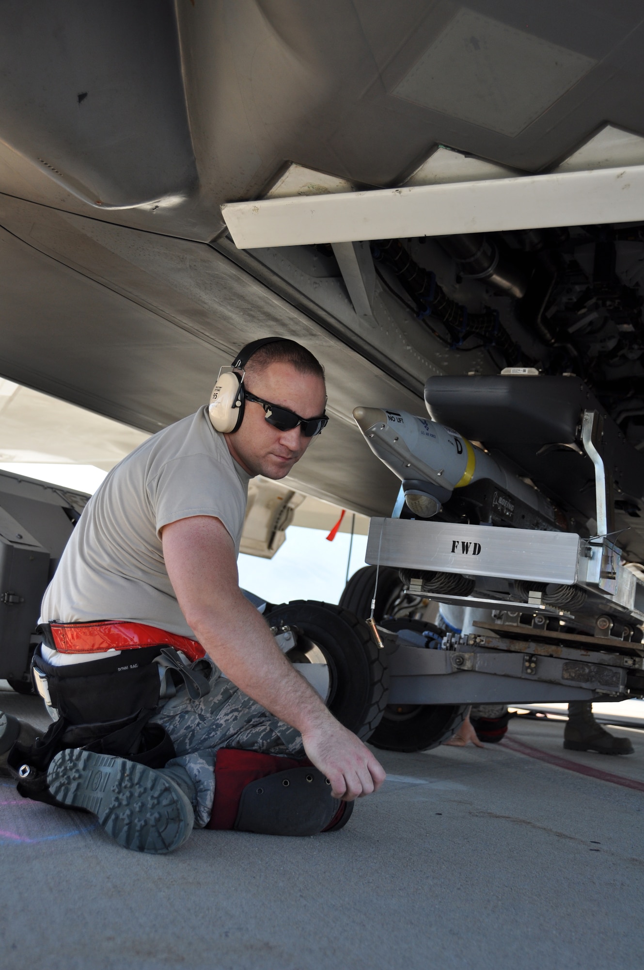 Staff Sgt. Brandon Vice, 477th Aircraft Maintenance Squadron weapons load crew member, guides a GBU-39 small diameter bomb into the main weapons bay of an F-22 during Combat Hammer. Combat Hammer is a weapons system evaluation program sponsored by the 86th Fighter Weapons Squadron, which provides an opportunity for an operational unit to employ them in a realistic tactical training environment.  (U.S. Air Force Photo/Tech. Sgt. Dana Rosso)