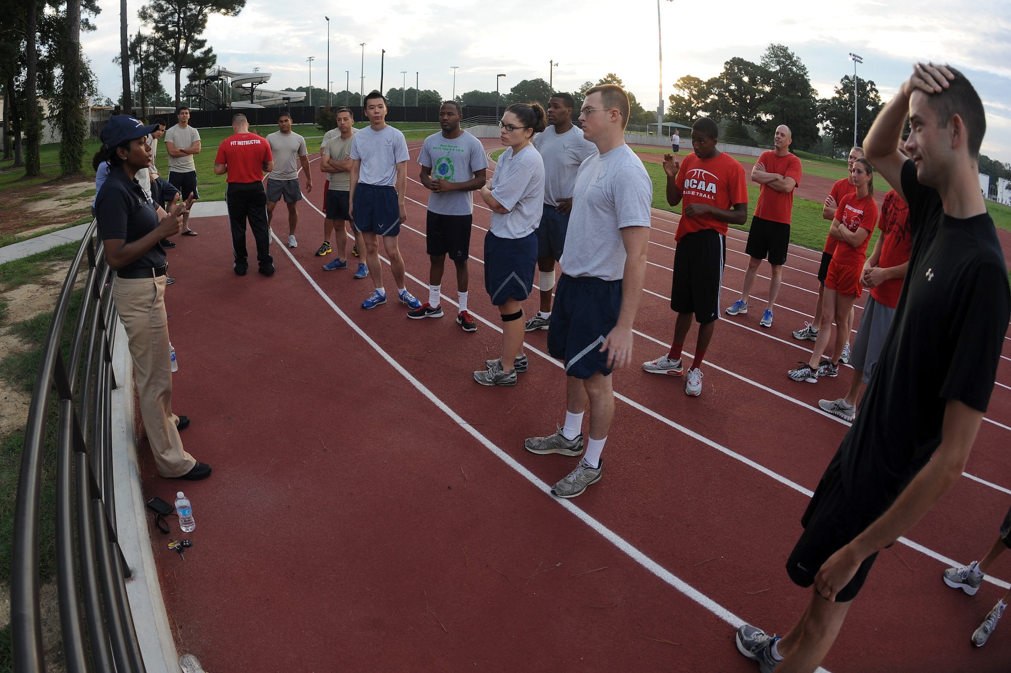 U.S. Air Force Senior Airman Leah Williams (left), 4th Force Support Squadron services journeyman, gives a briefing on the rules for the Beat the Heat relay run at Seymour Johnson Air Force Base, N.C., Aug. 10, 2012. Teams consisted of five individuals with a minimum of one female. (U.S. Air Force photo/Airman 1st Class John Nieves Camacho/Released)