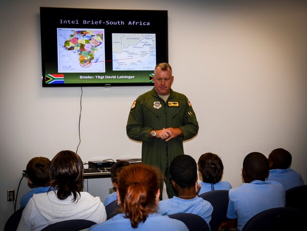 Colonel Erik Hansen, 437th Airlift Wing commander, briefs Youth Center – Air Base children during the Children’s Deployment Camp, Aug. 14, at Joint Base Charleston – Air Base, S.C. The Children’s Deployment Camp, hosted by the Airman and Family Readiness Center, offered children, age five to 14 whose parents have recently returned from deployment, are currently deployed or are scheduled to deploy within the next six months, the opportunity to experience many of the same things their parents have to go through to prepare for a deployment. (U.S. Air Force photo by Senior Airman Anthony Hyatt)