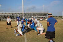 Members of the Joint Base San Antonio-Randolph High School Ro-Hawks football team run gauntlet drills during early morning practice Aug 13.  The football team started summer practice at Randolph , Aug 6. (U.S. Air Force photo by Rich McFadden) 
