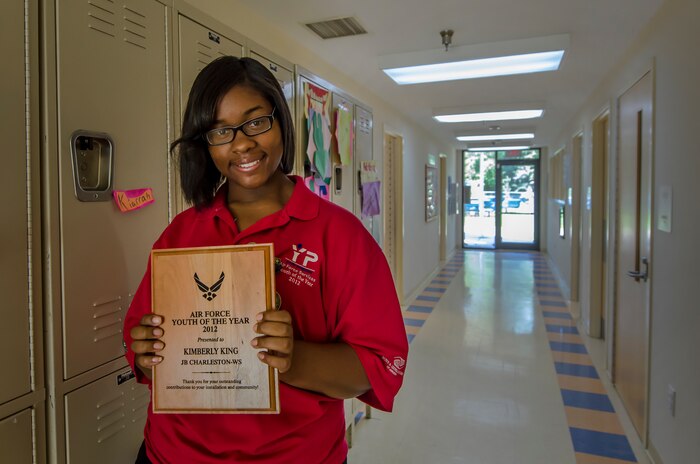 Kimberly King, 15, was recently recognized during the 2012 Air Force Boys and Girls Clubs of America Youth of the Year Award ceremony June 22 at the Pentagon auditorium in Washington, D.C. King was presented an award by Maj. Gen. Darren McDew, Air Force District of Washington commander, during her trip to the Pentagon. This annual event recognized more than 50 Air Force youths from bases across the Air Force for their contributions to their installations youth programs, families, schools and communities. (U.S. Air Force photo by Airman 1st Class George Goslin)